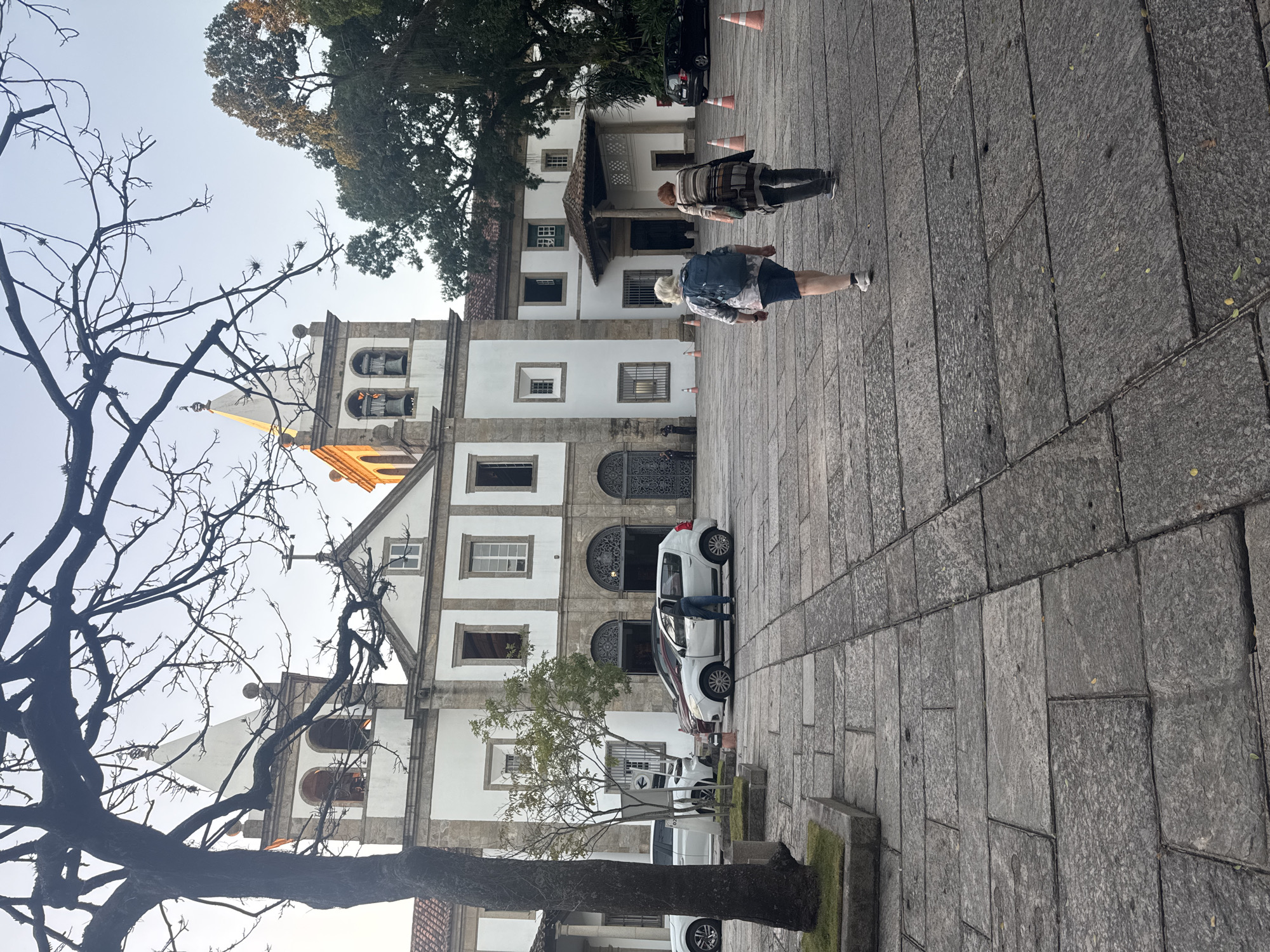 Historic church plaza in Rio, statues and old trees