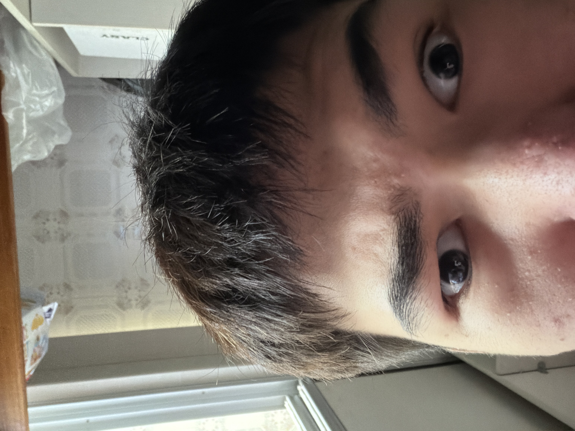 Selfies and a cockatiel at home in Shymkent