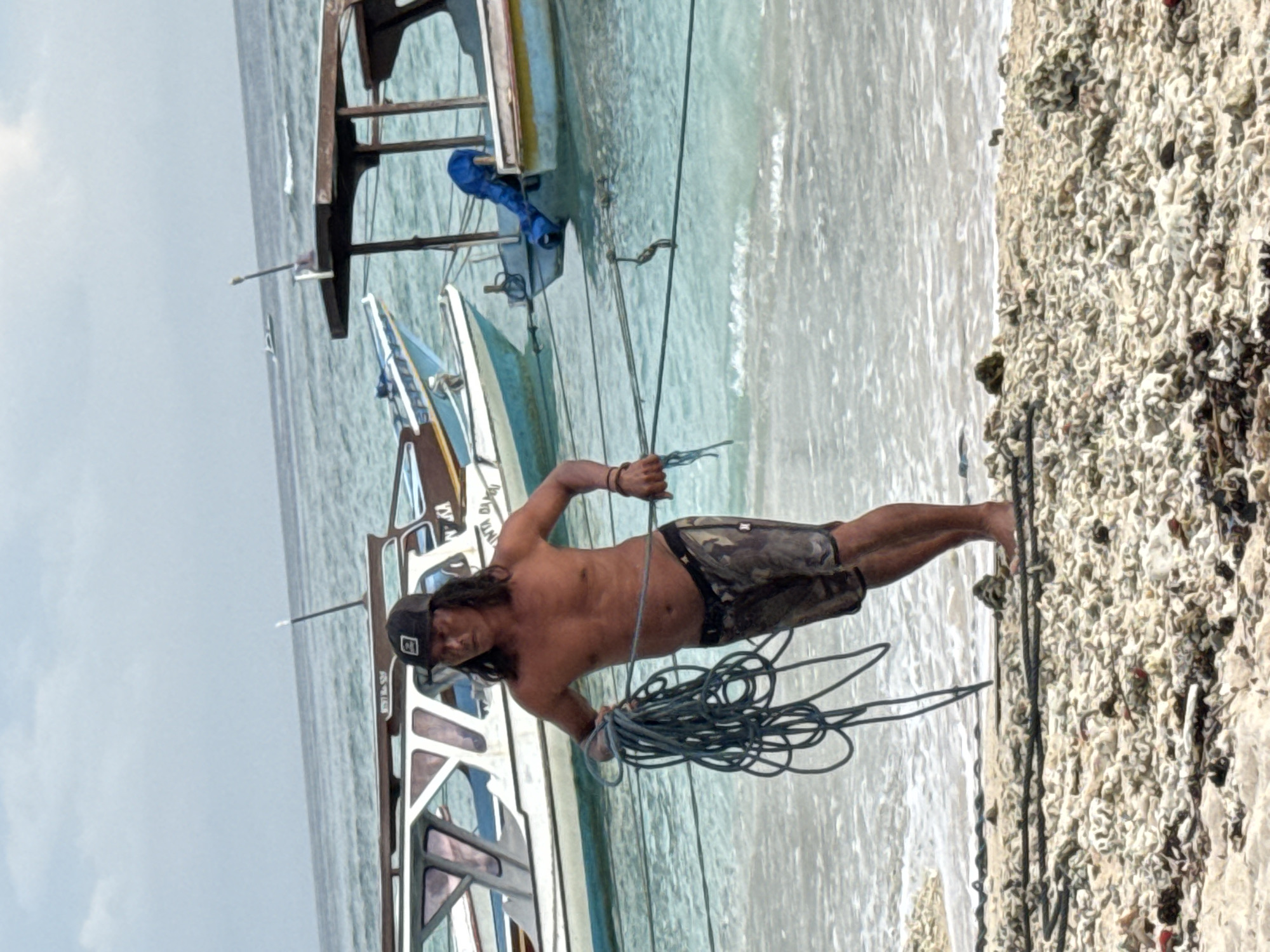 Man with rope observed on Indonesian beach