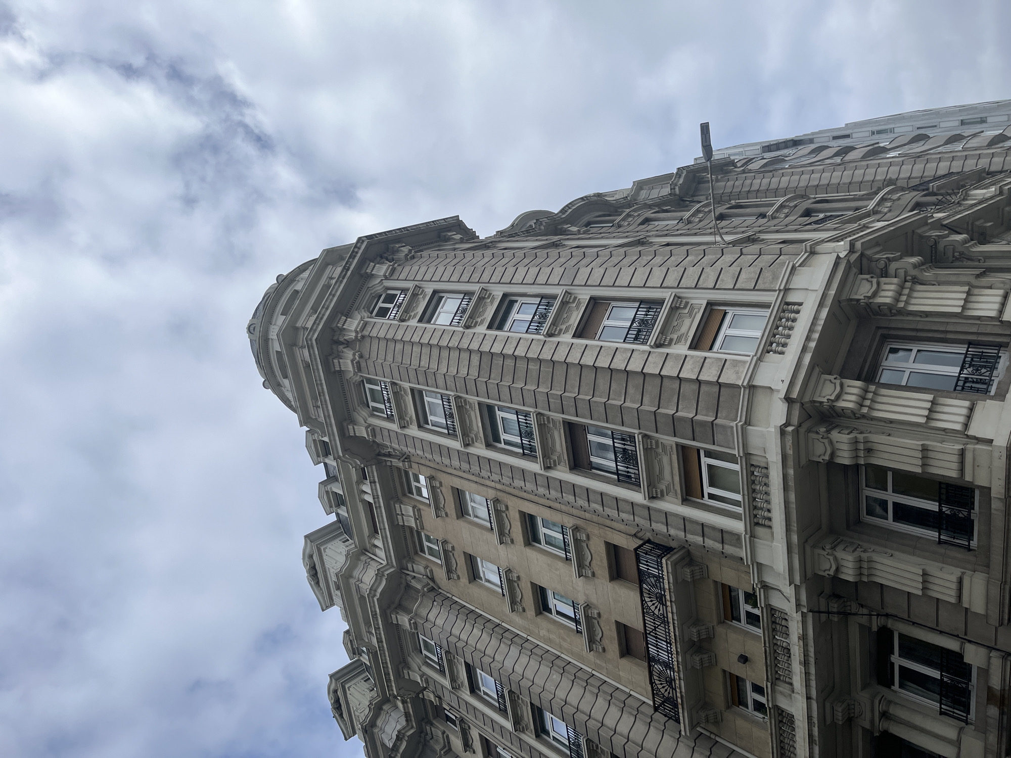 Ornate building photographed from below in A Coruña, Spain
