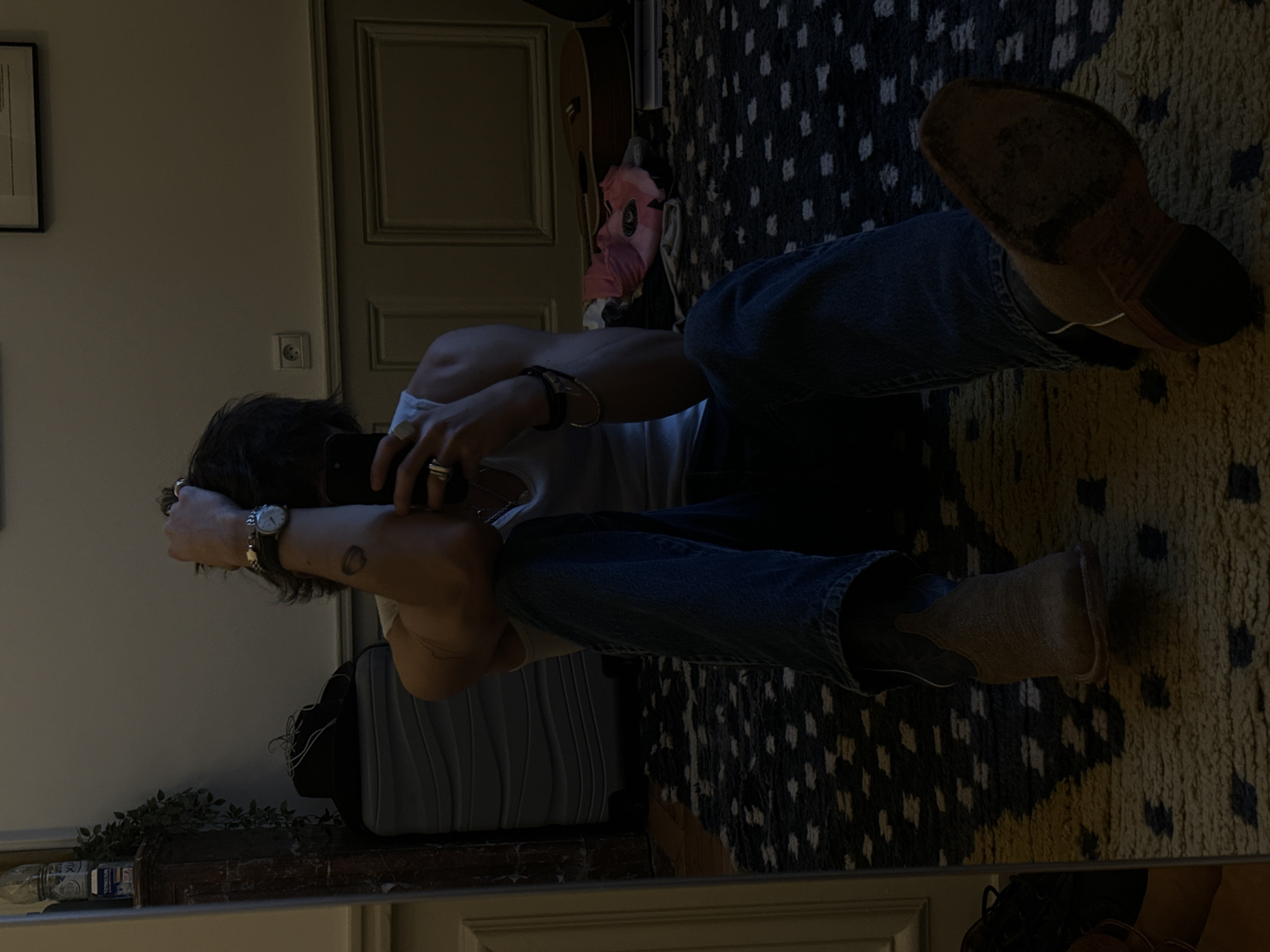 Person takes mirror selfies in Paris apartment
