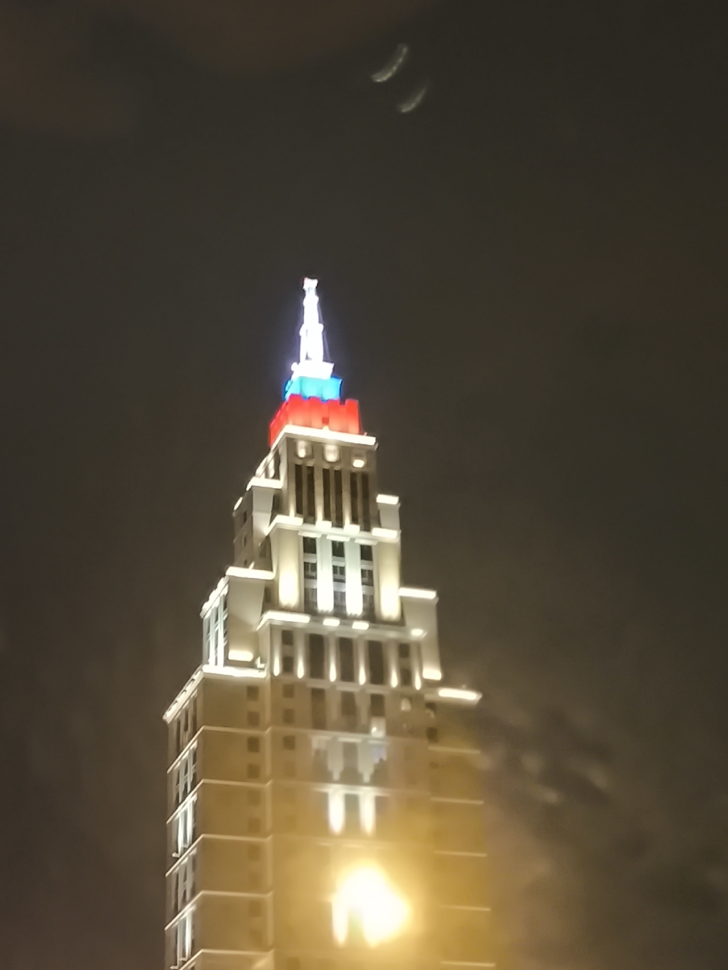 Moscow building displays patriotic lighting during evening hours
