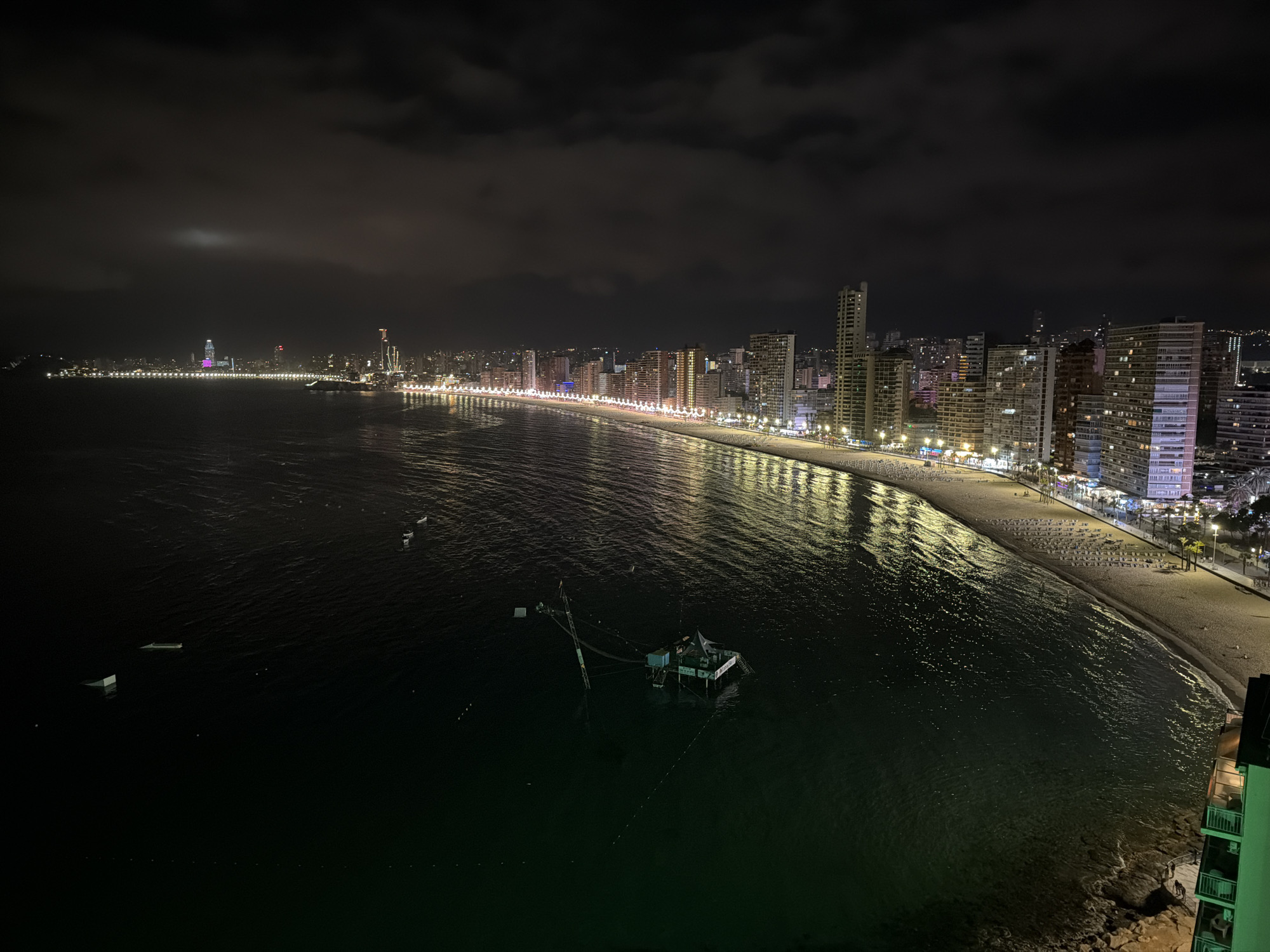 Night photography captures Benidorm's illuminated crescent bay coastline