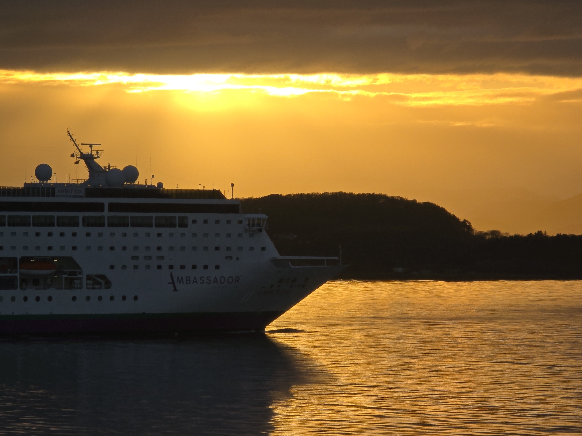 Cruise ship Ambassador sails past Randaberg during dramatic sunset