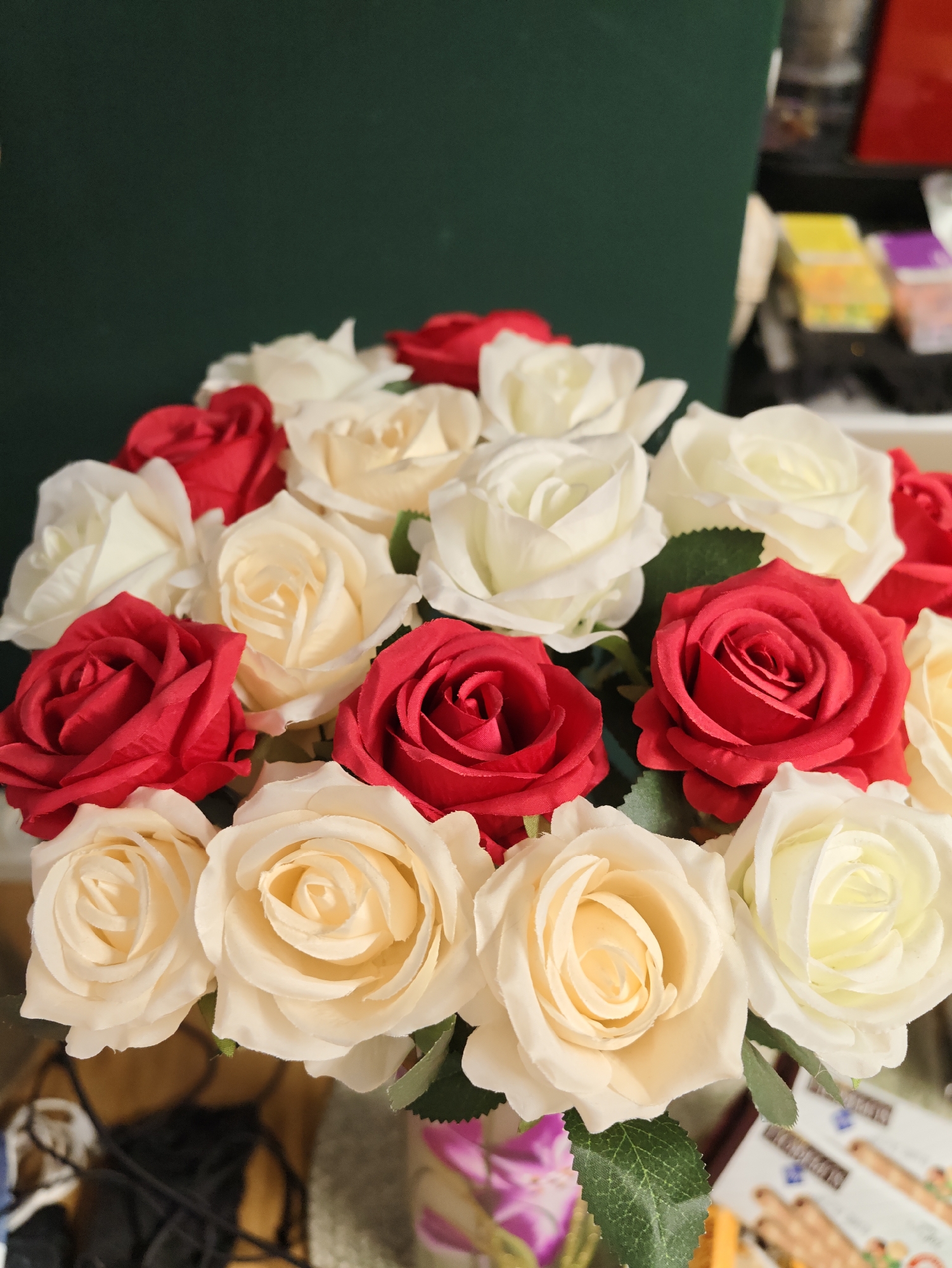 Cat, fake roses, and decorative knives in a Petah Tikva home