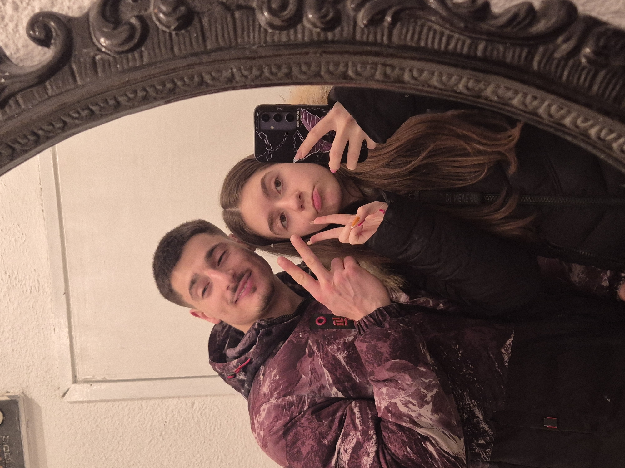 Couple cooks dinner together, documents evening with selfies