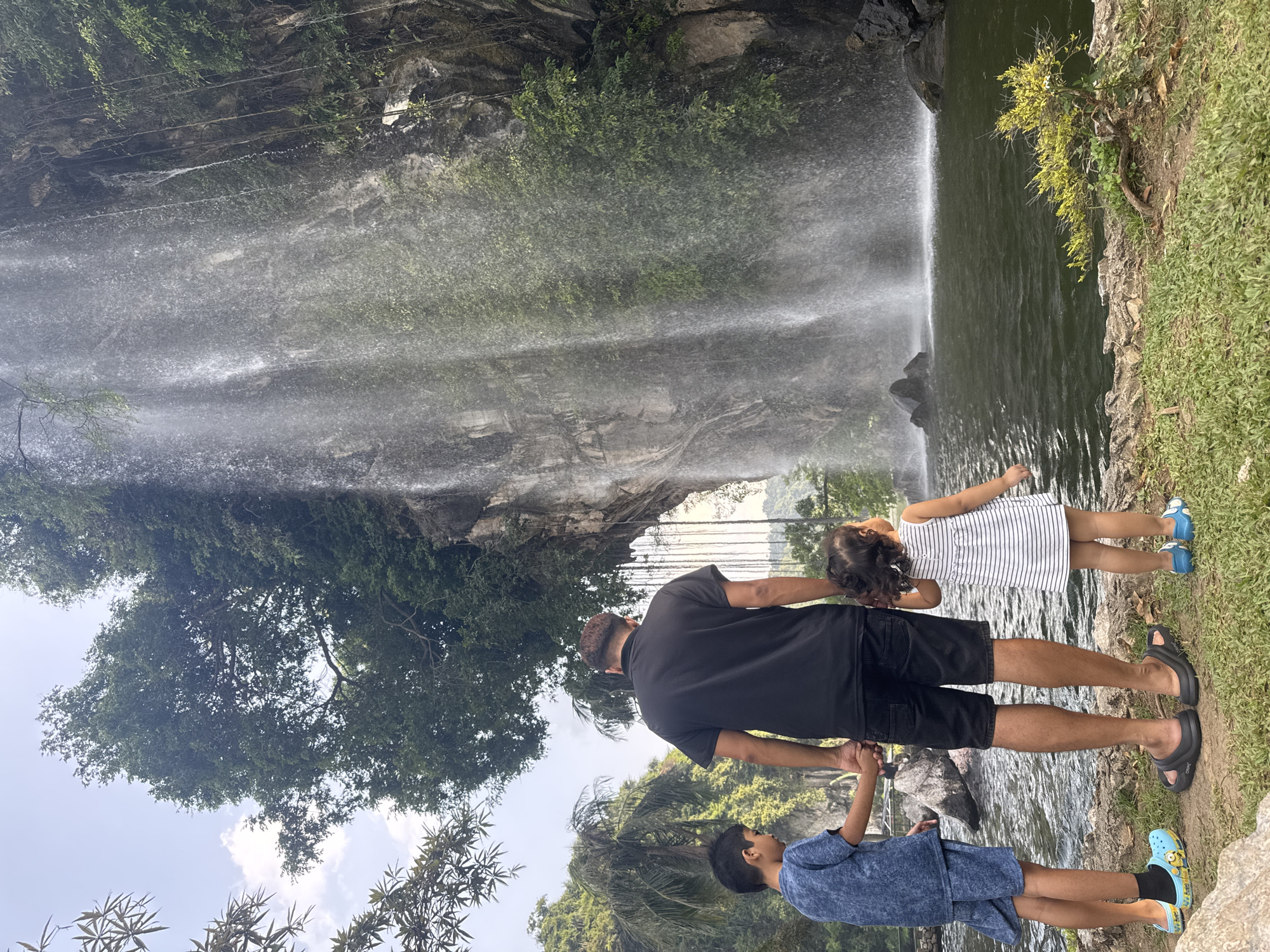 Tourists capture waterfalls at Ipoh recreational parks and temples