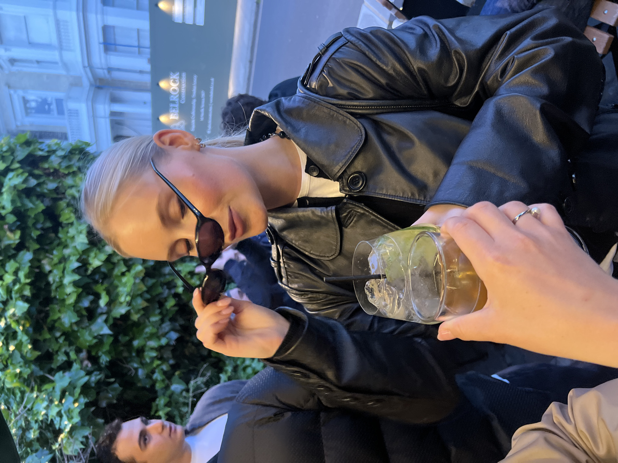 Two women photographed with drinks at London venue