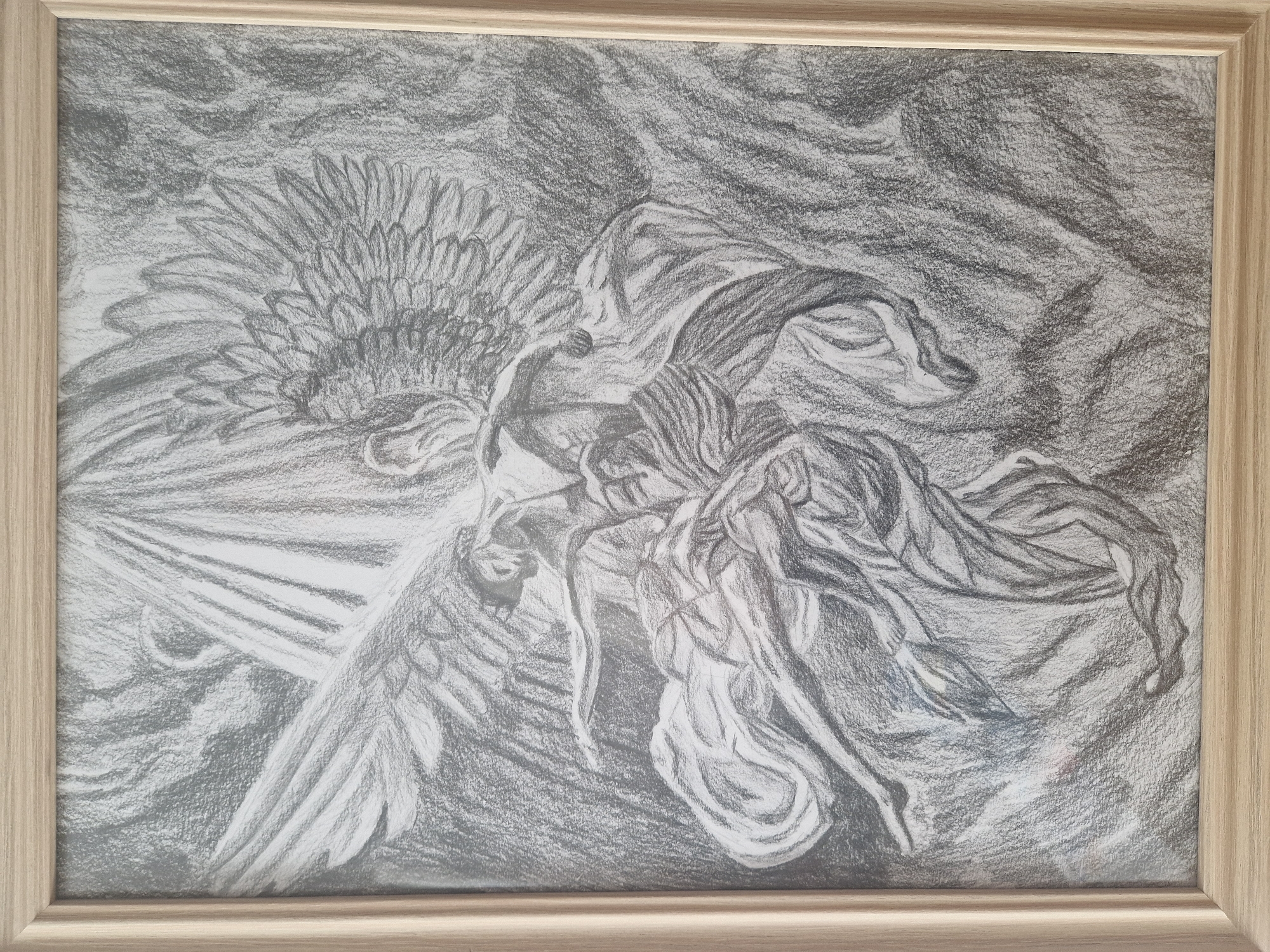 Framed pencil drawing of winged figure observed
