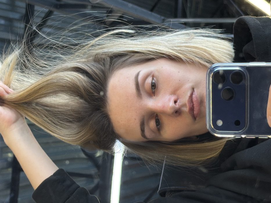 Woman documents extended selfie session in Russian industrial office