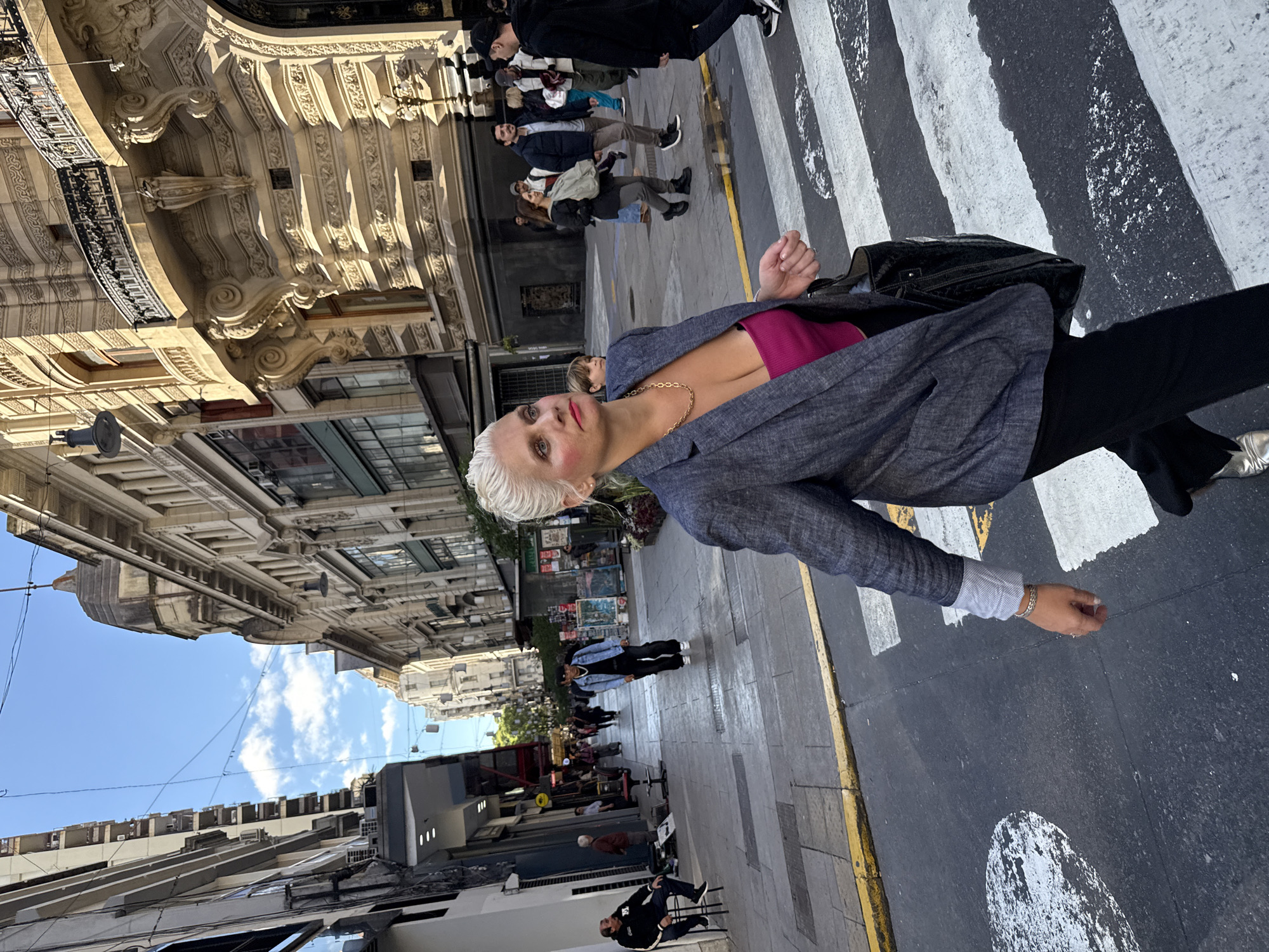 Woman in business attire observed on Buenos Aires crosswalk