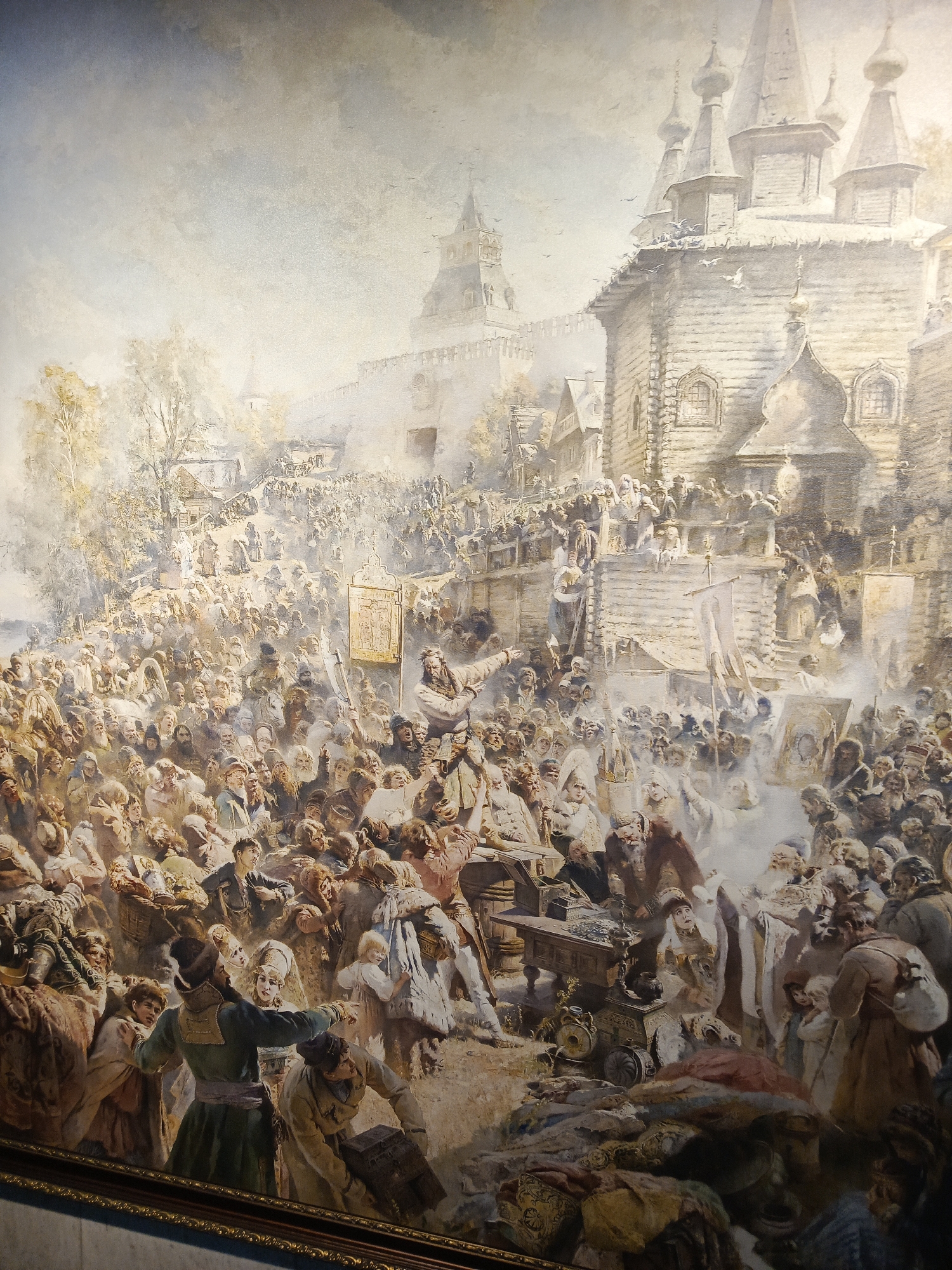 Museum visitor views traditional Russian paintings in Nizhny Novgorod