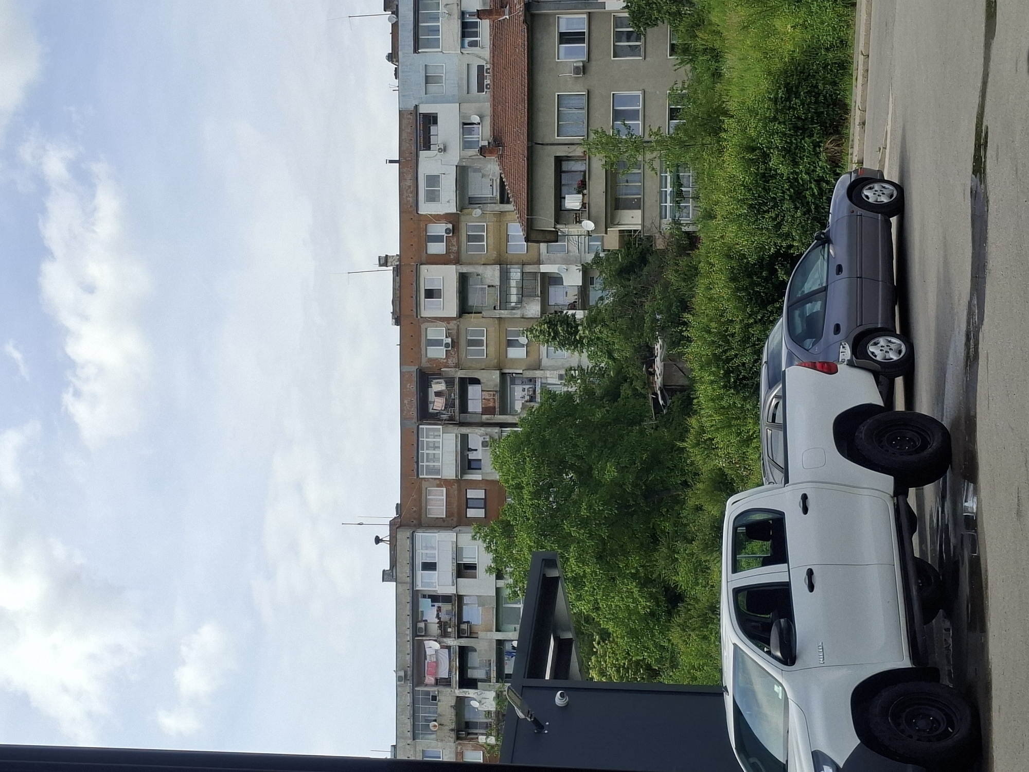 Urban scenes documented: residential building, Bulgarian-plated Toyota in garage