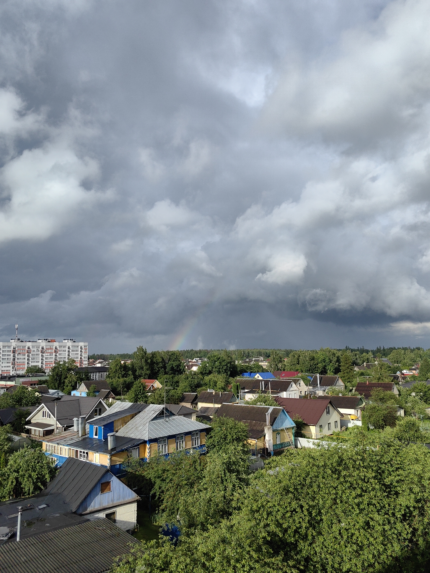 Rainbow over Fanipal residential area with indoor snacking moments