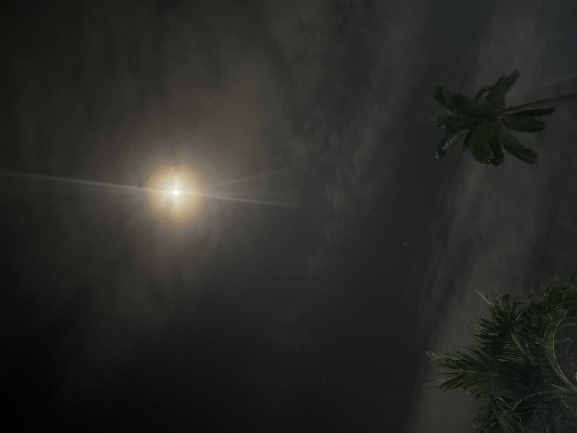 Bright light streaks observed through clouds in Rumuomasi, Nigeria