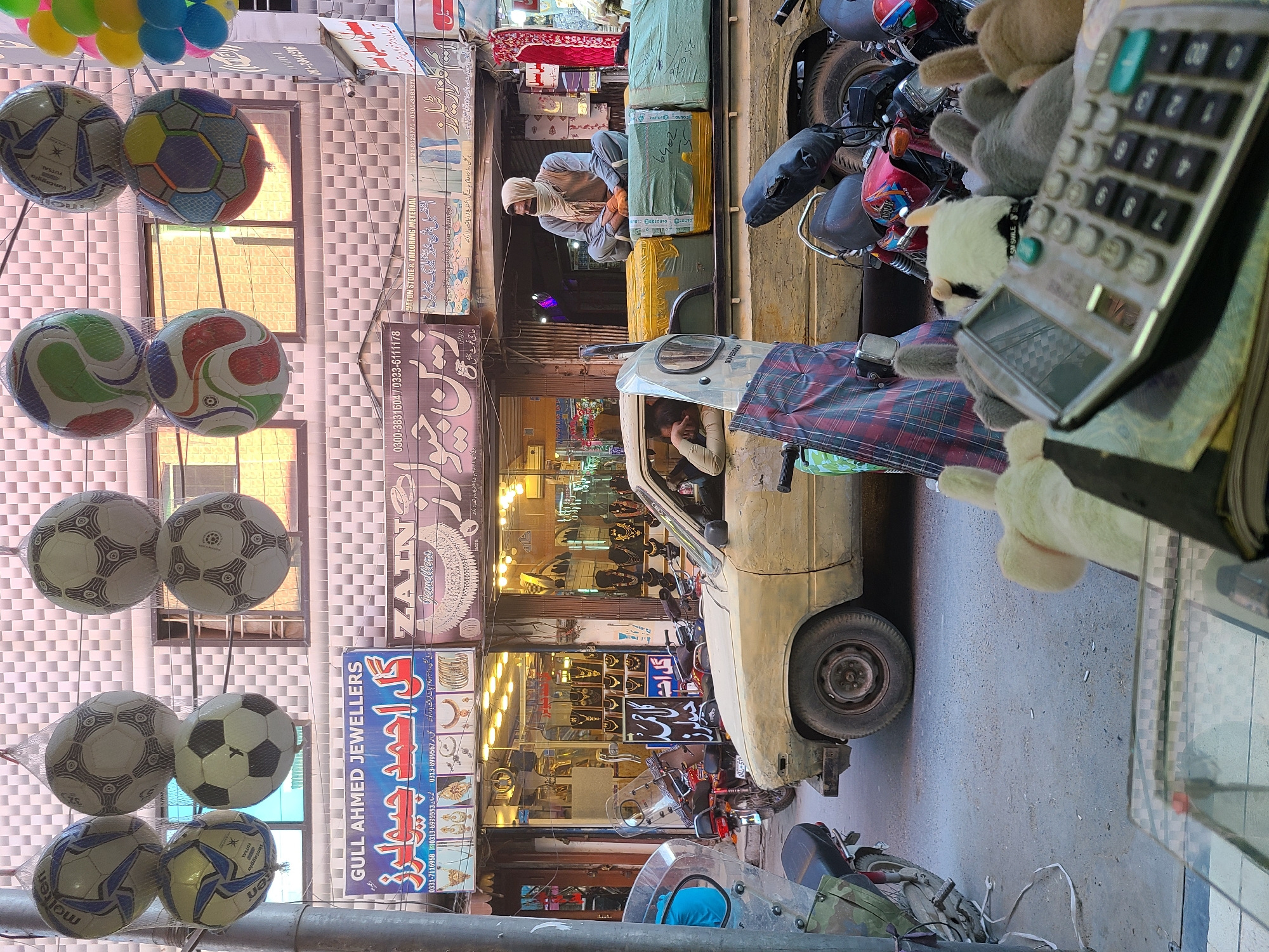 Urban street scene documented in South Asian commercial district