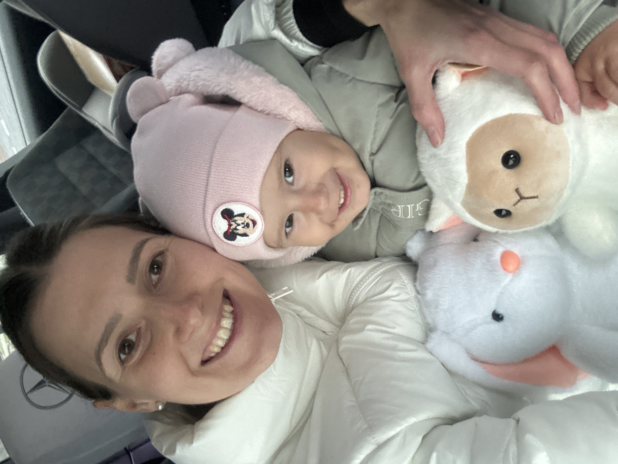 Woman and child share indoor selfie moment in Wisła