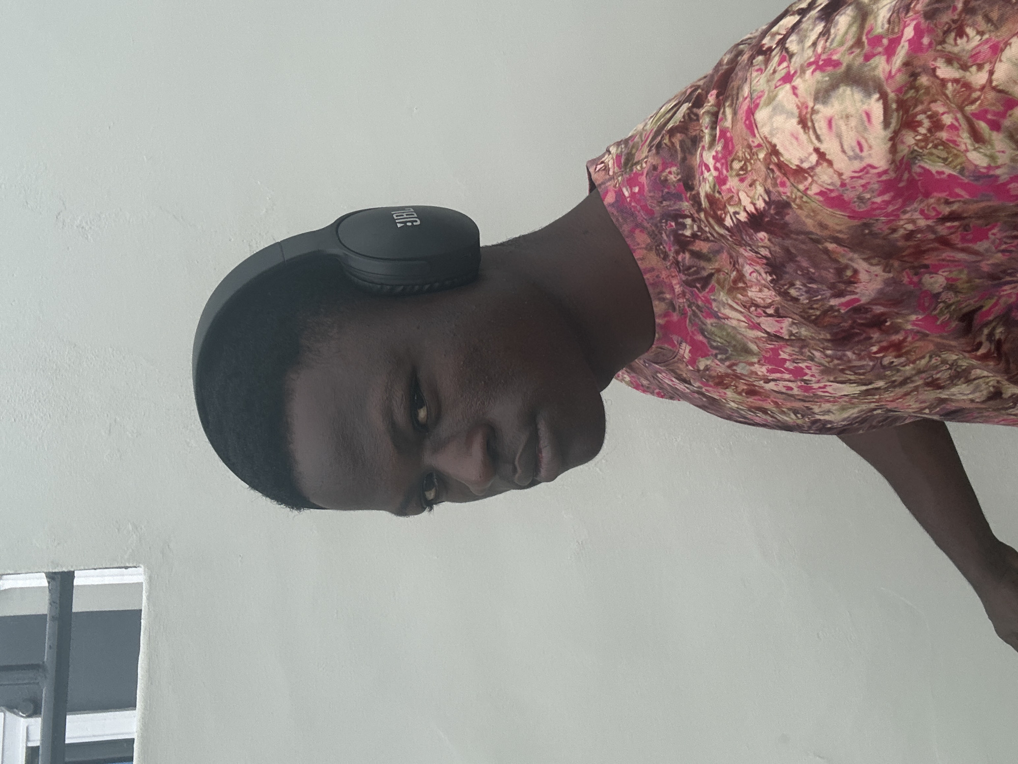 Selfie session in Badagry with headphones and tie-dye