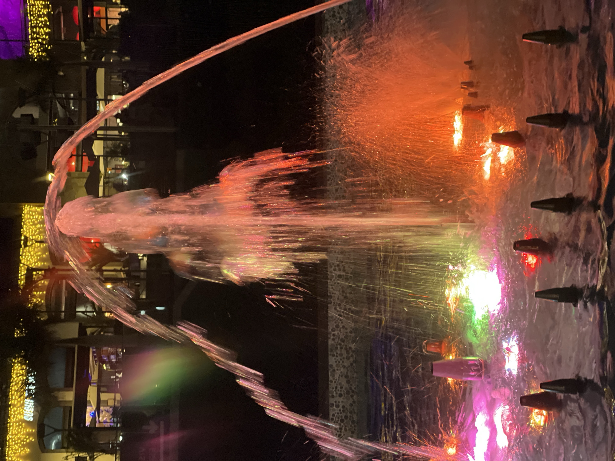 Colorful illuminated fountains light up Spanish resort town