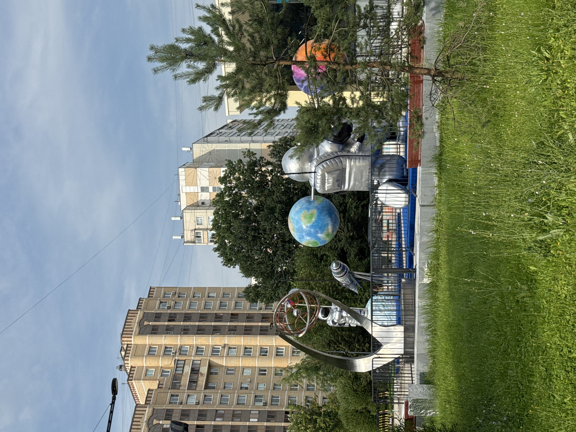 Zelenograd's space-themed public square on a summer afternoon