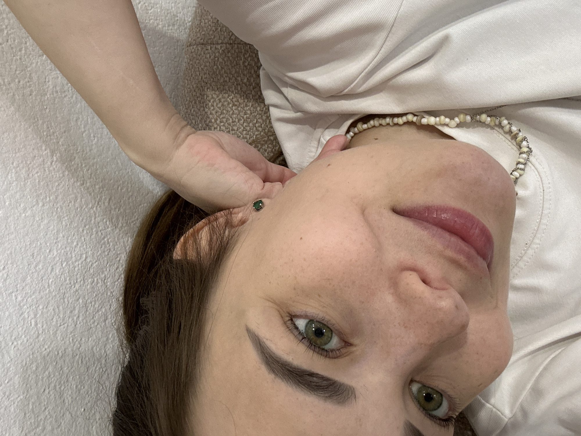 Young person takes morning selfie on sofa in Perm