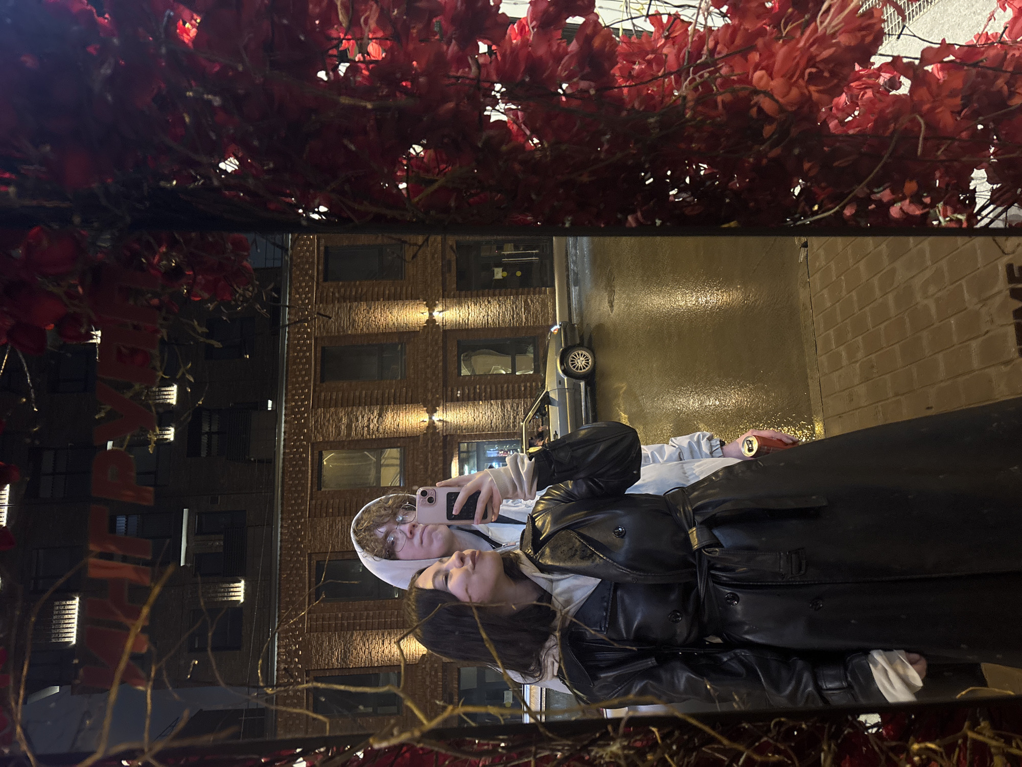 Two people photographed in reflection on wet surface in Perm