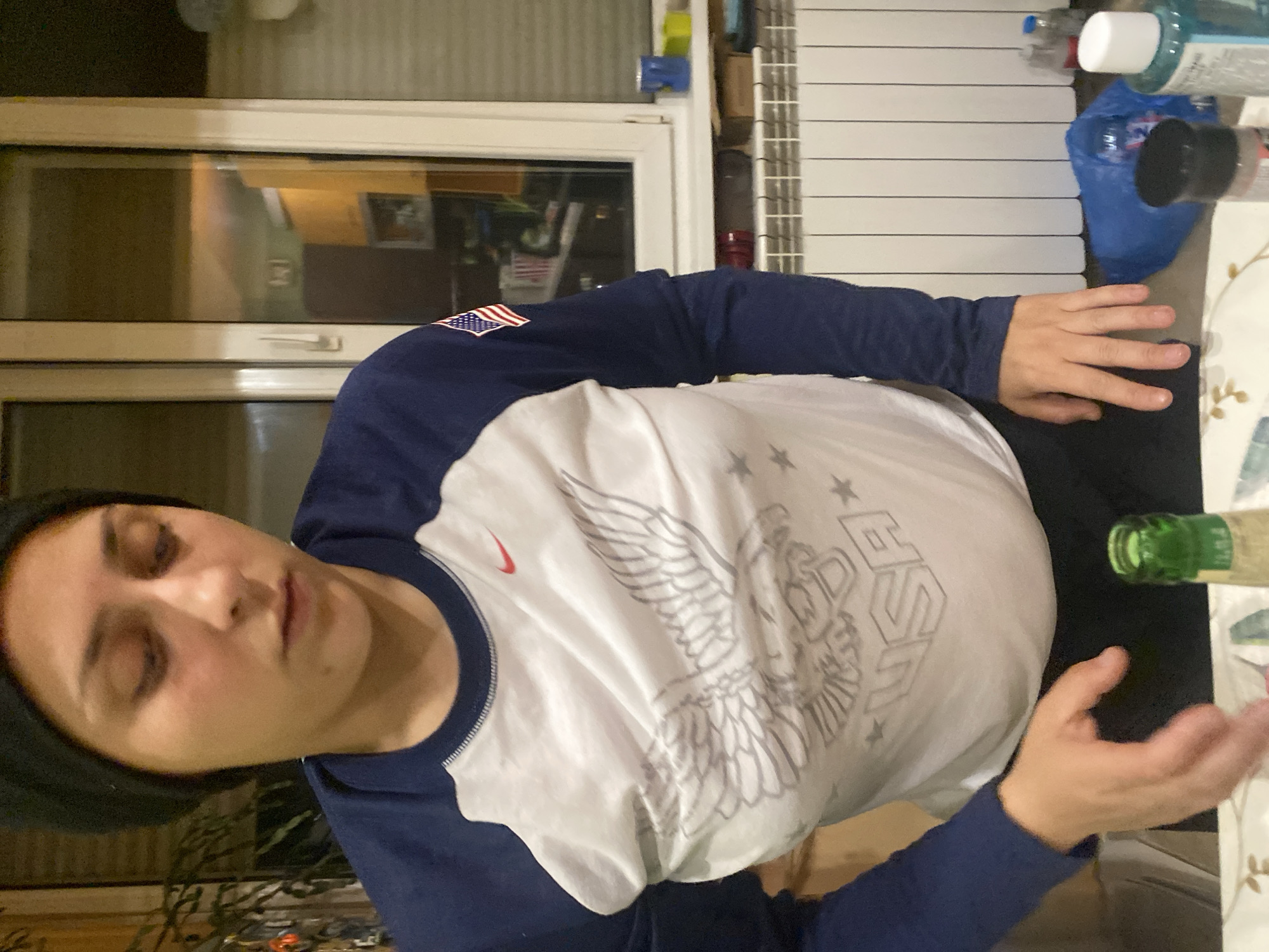 Woman in USA eagle shirt spotted indoors Sofia
