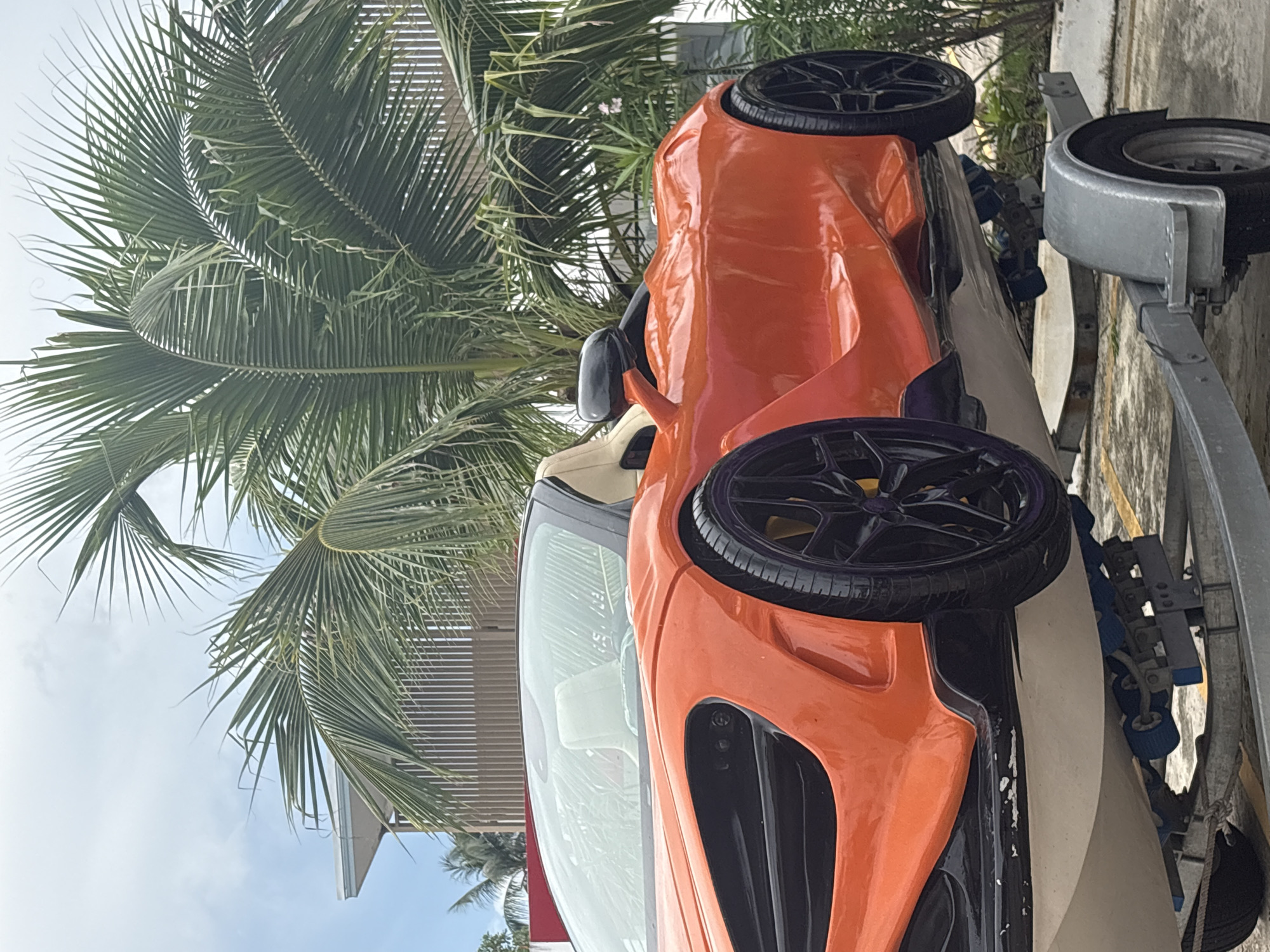 Two McLaren supercars on a trailer turn heads in Rawai