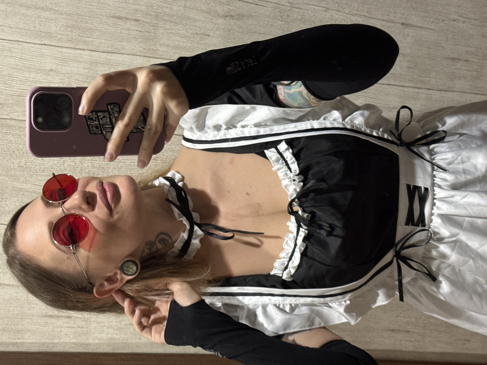 Maid costume selfie with bold accessories in Norilsk