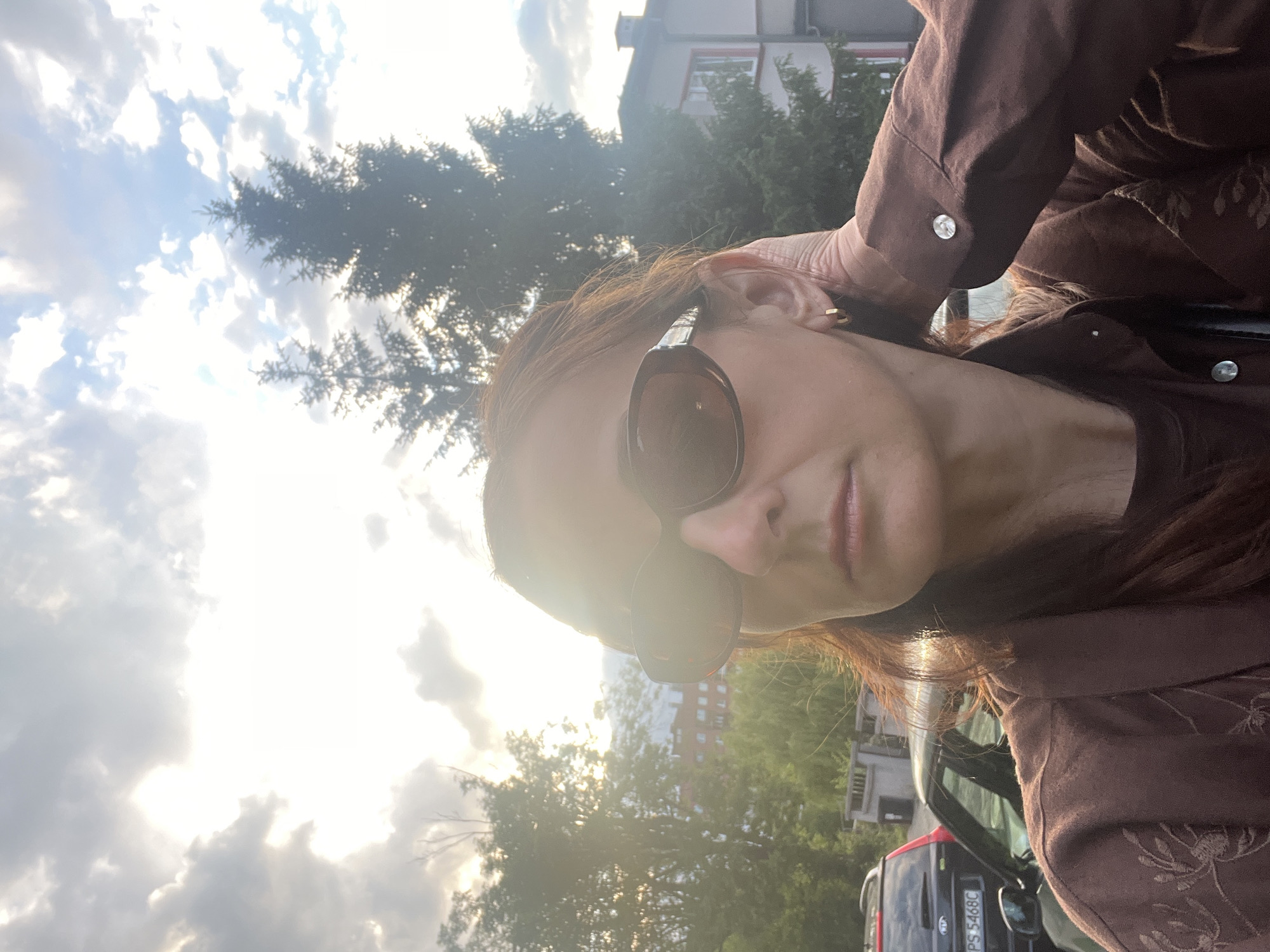 Woman documents afternoon walk with series of street selfies