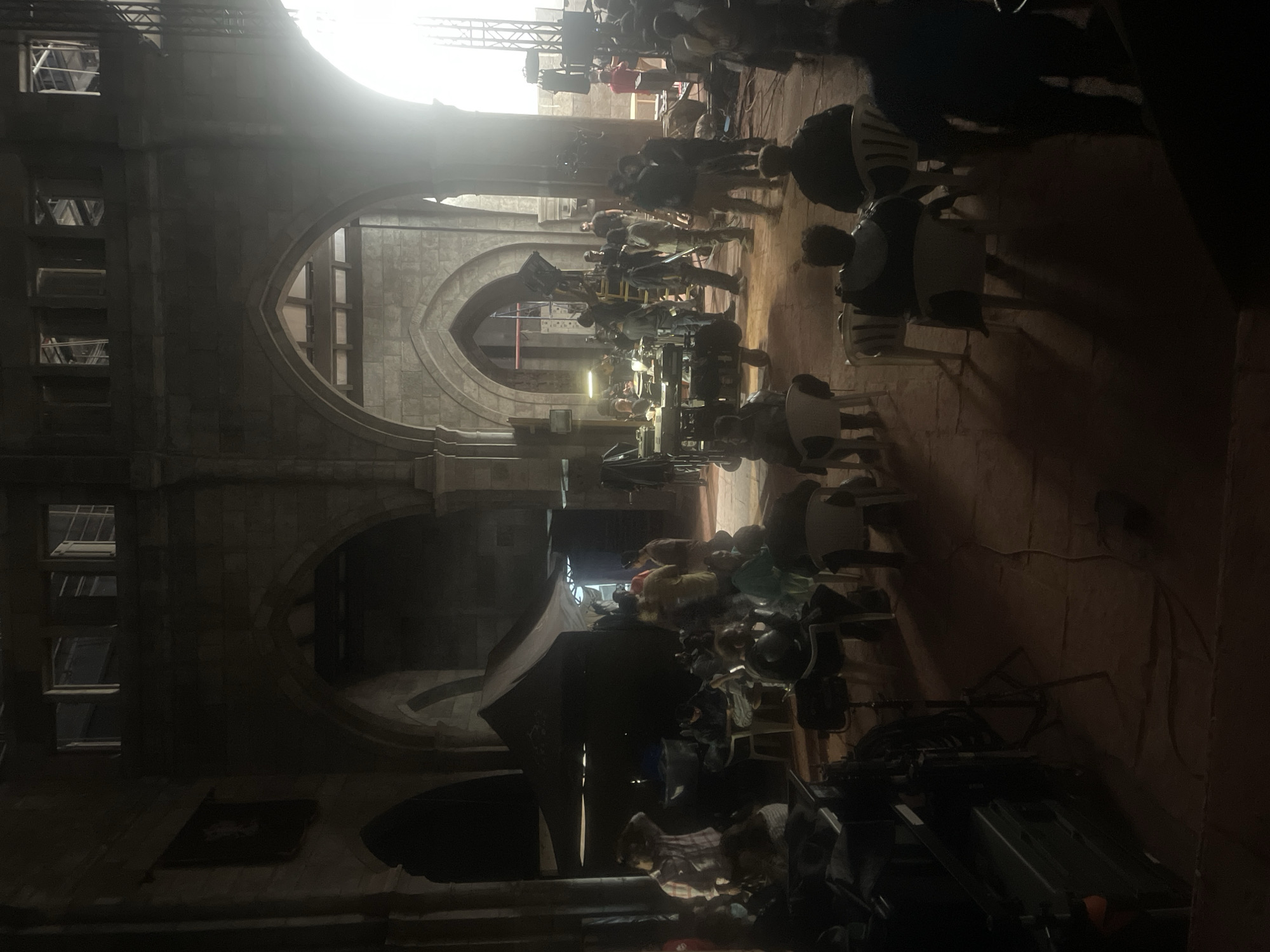 Film set or event preparation documented in Mumbai stone building