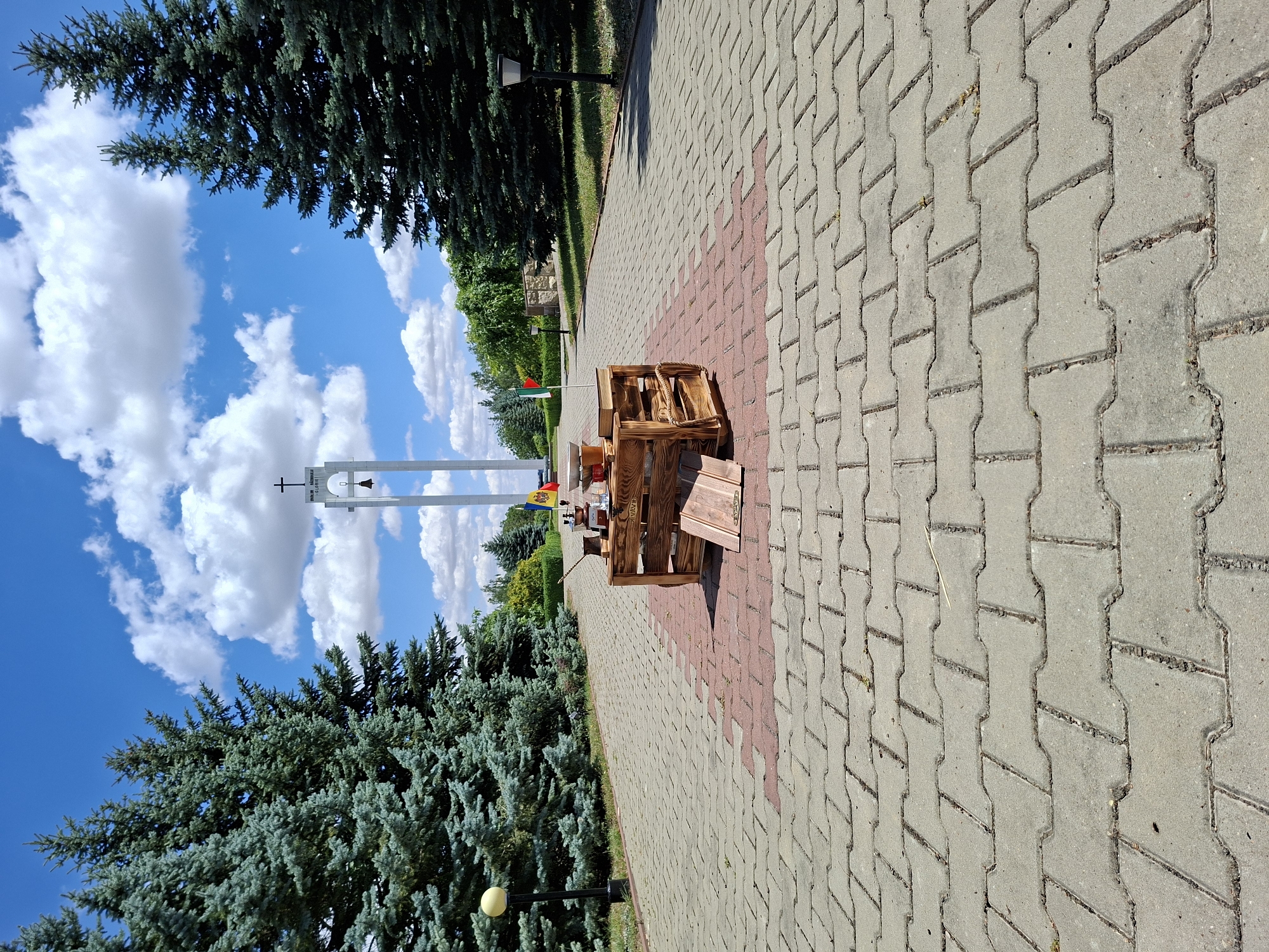 Rustic coffee setup near a bell tower in Șerpeni, Moldova