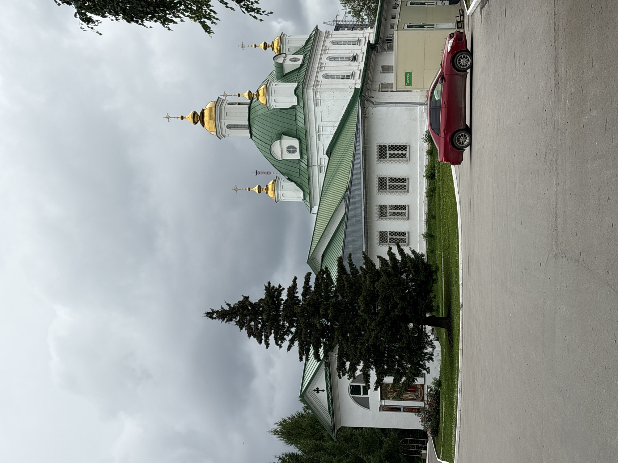 Perm's Orthodox cathedrals and garden details on a cloudy morning
