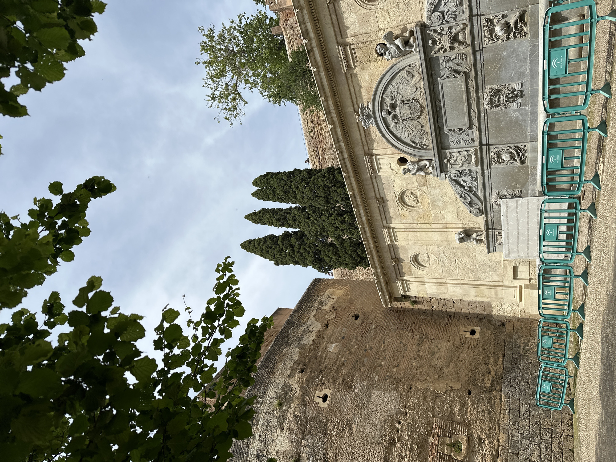 Tourist documents Granada's historic sites and gardens during afternoon visit