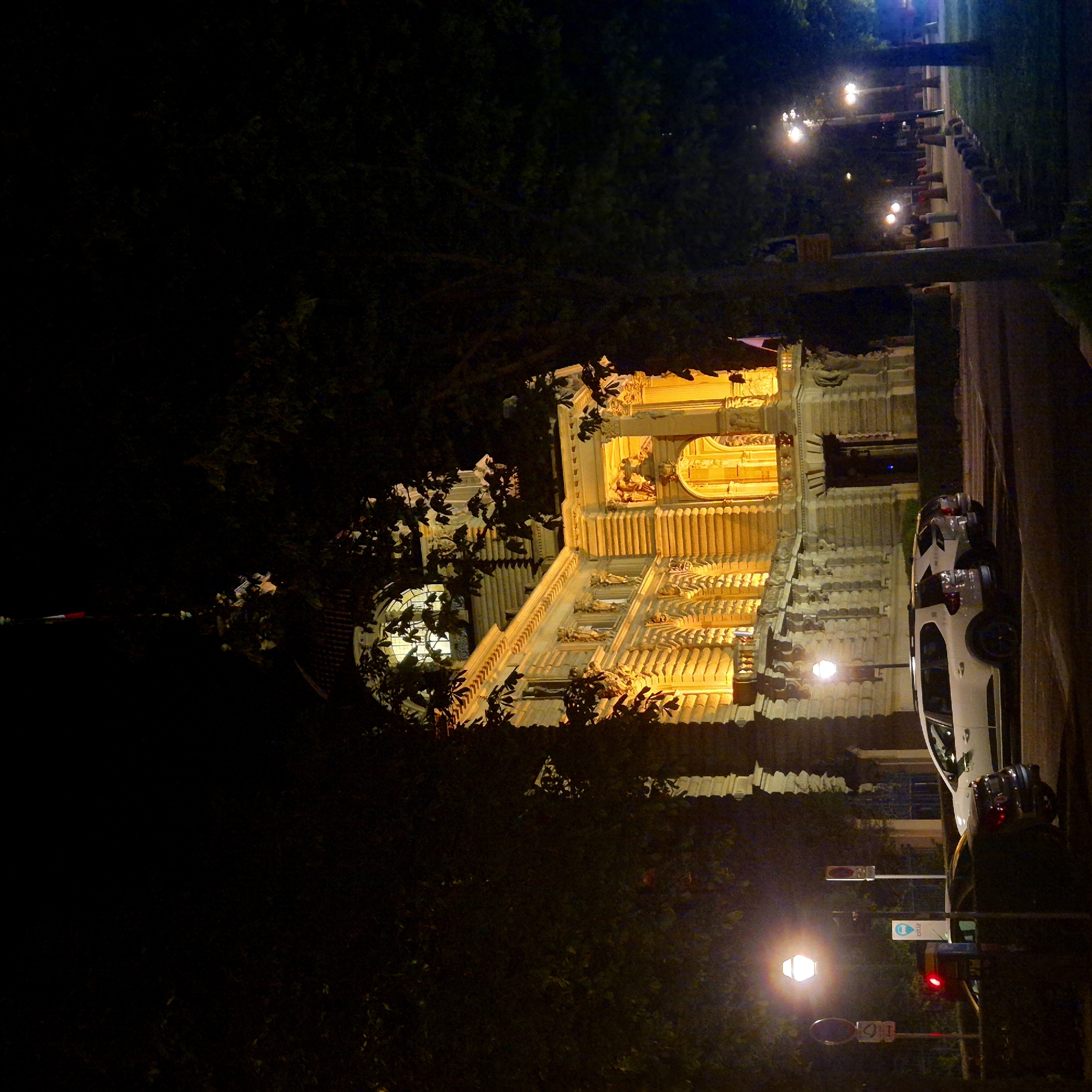 Ornate stone building illuminated at night in Strasbourg