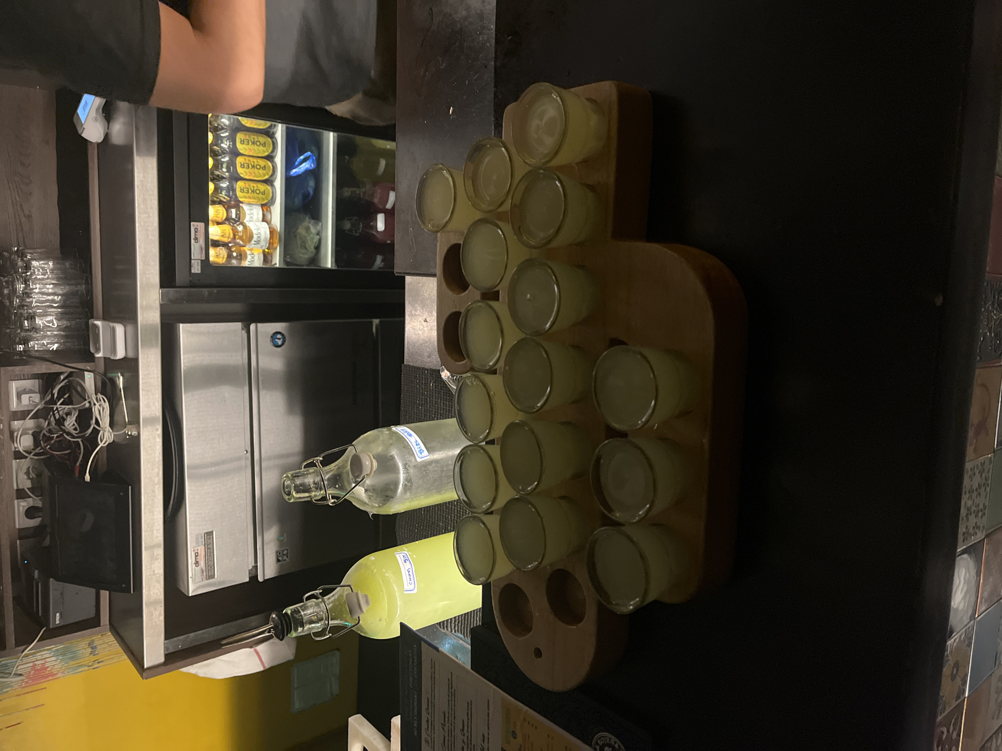 Evening bar scene captured in Lyon with beverages and shots
