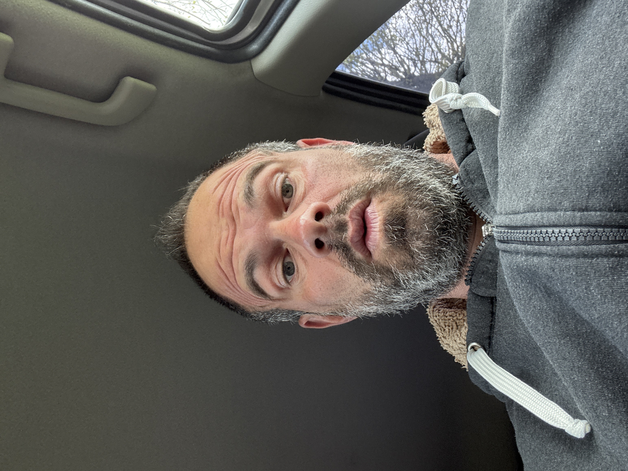 Man takes selfie in vehicle in Marche-en-Famenne, Belgium