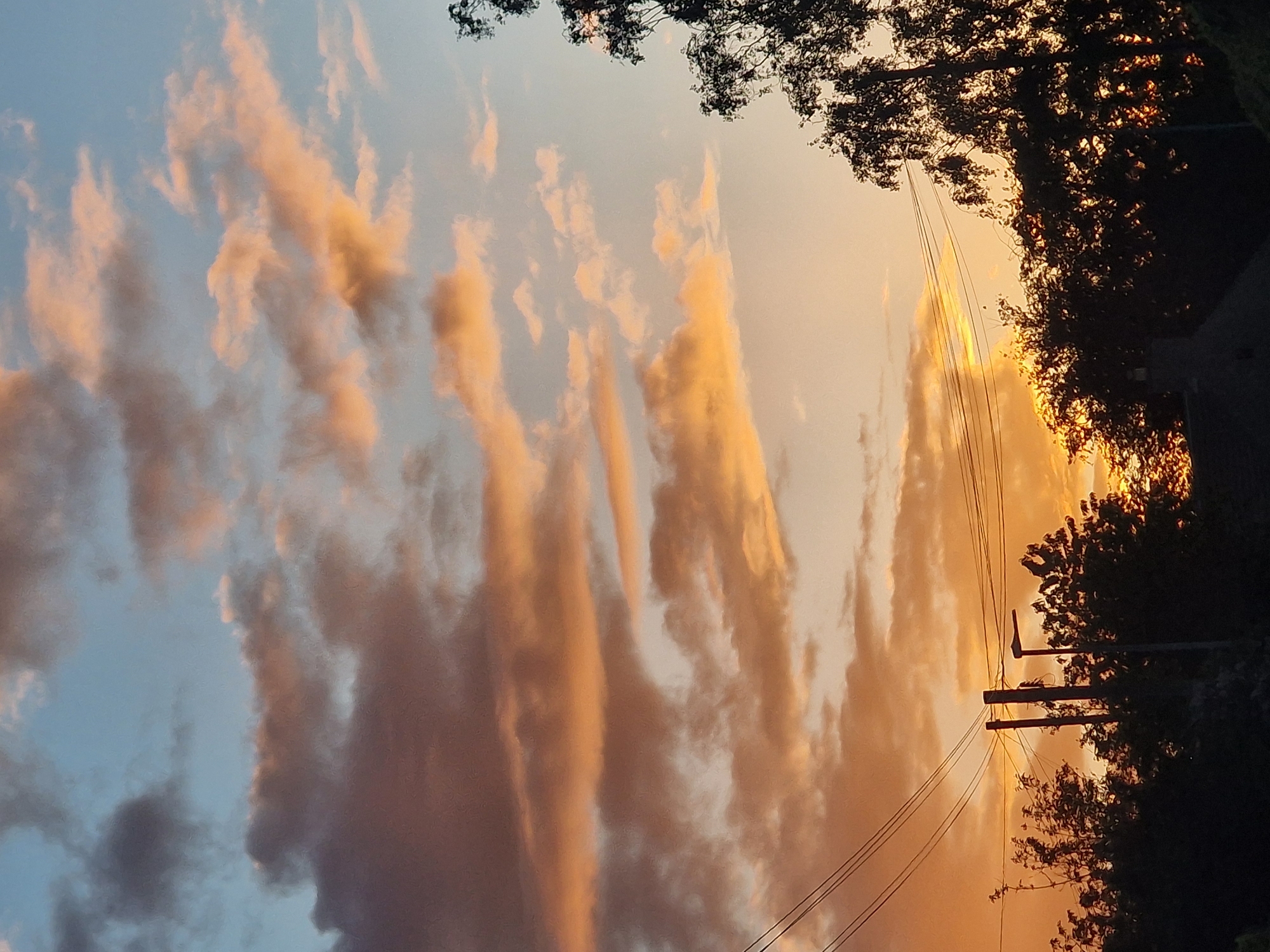 Colorful evening sky with striated clouds observed in Durham