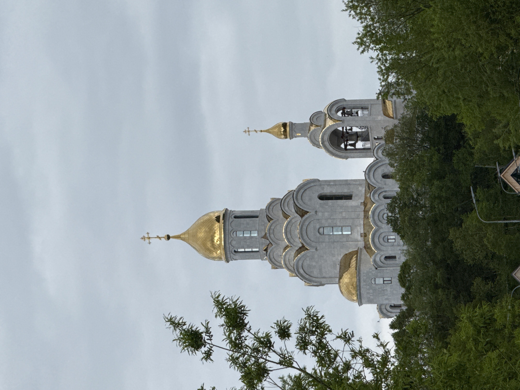 Overcast waterfront visit near an Orthodox church in Kamchatka