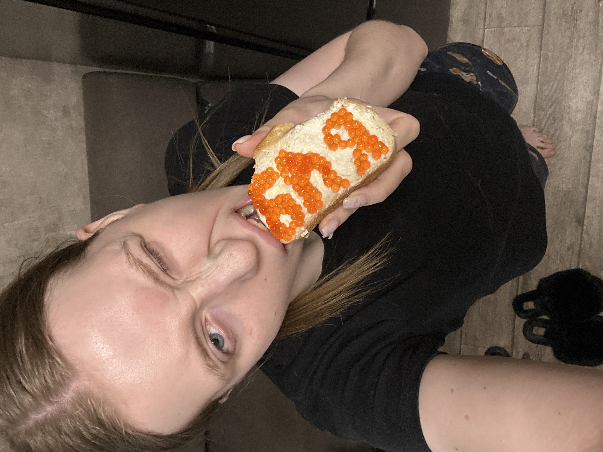 Women photographed with caviar bread in Chaikovsky, Russia