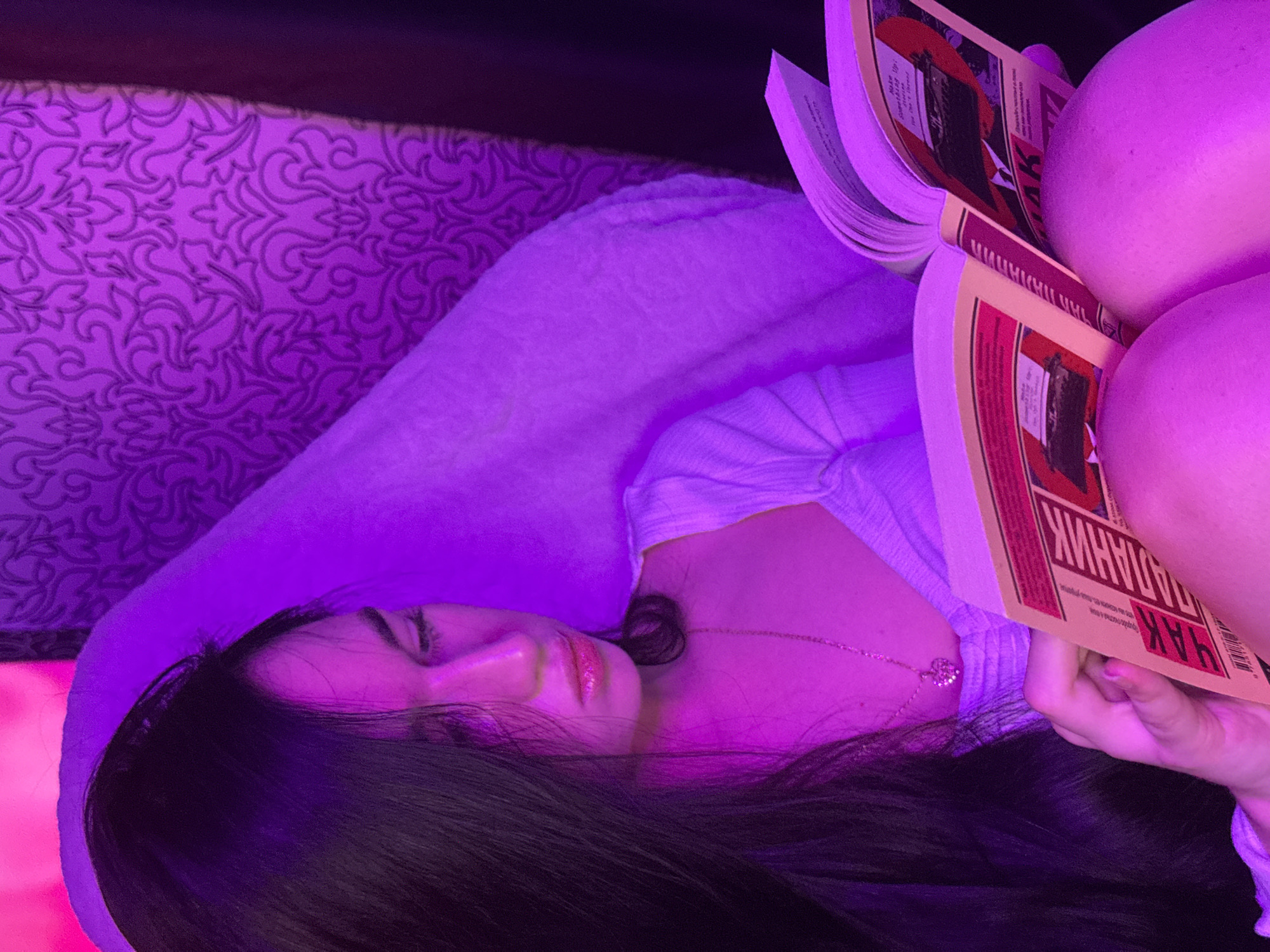 Purple-lit streaming session with microphone setup in Novosibirsk