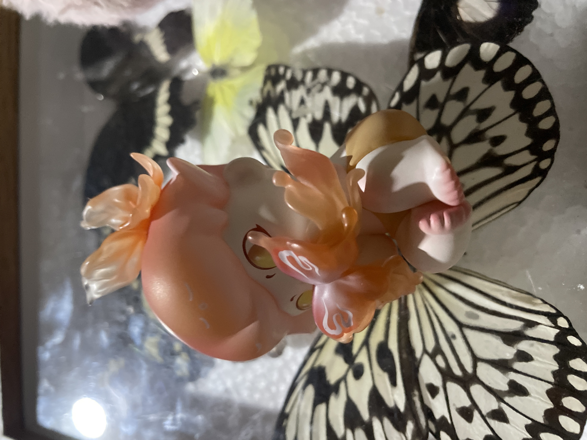 Private butterfly collection displayed with figurines in Davao City