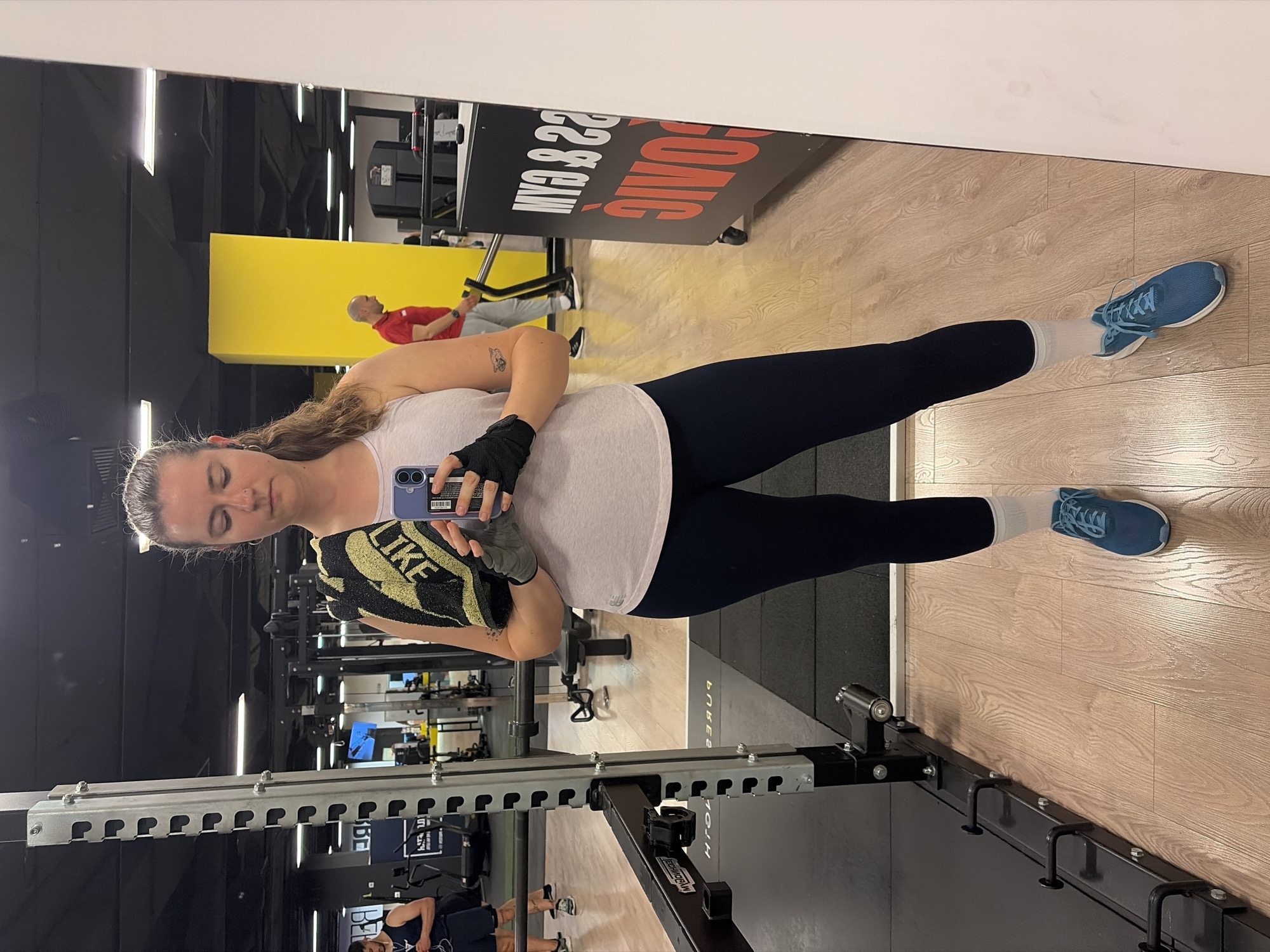 Woman takes mirror selfie at Belgrade gym