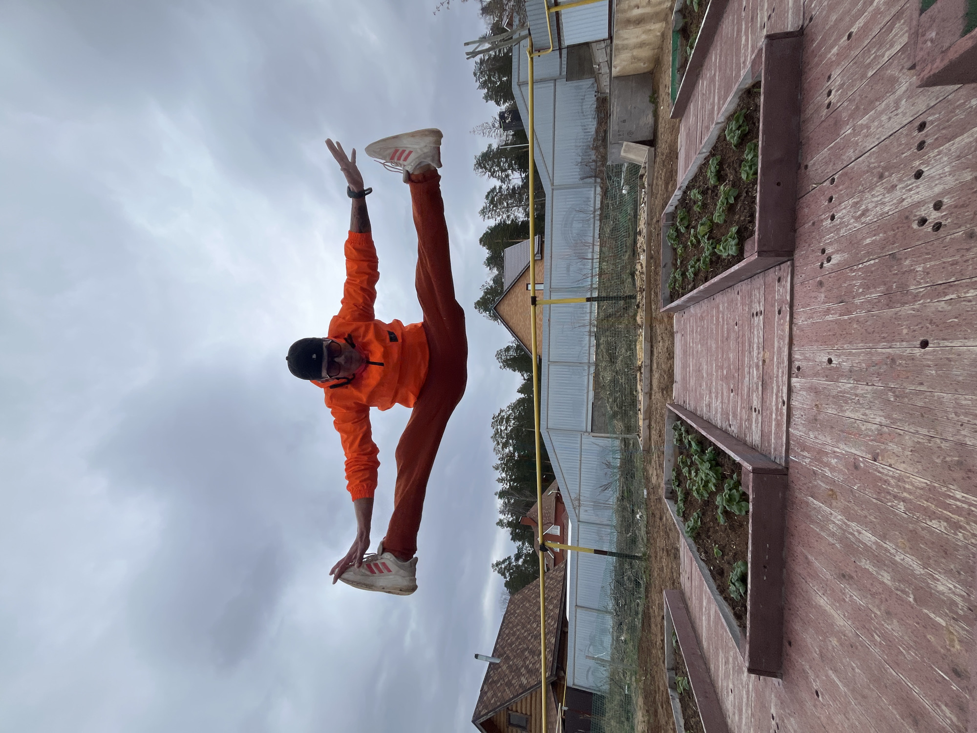 Man performs morning acrobatics routine in Russian backyard