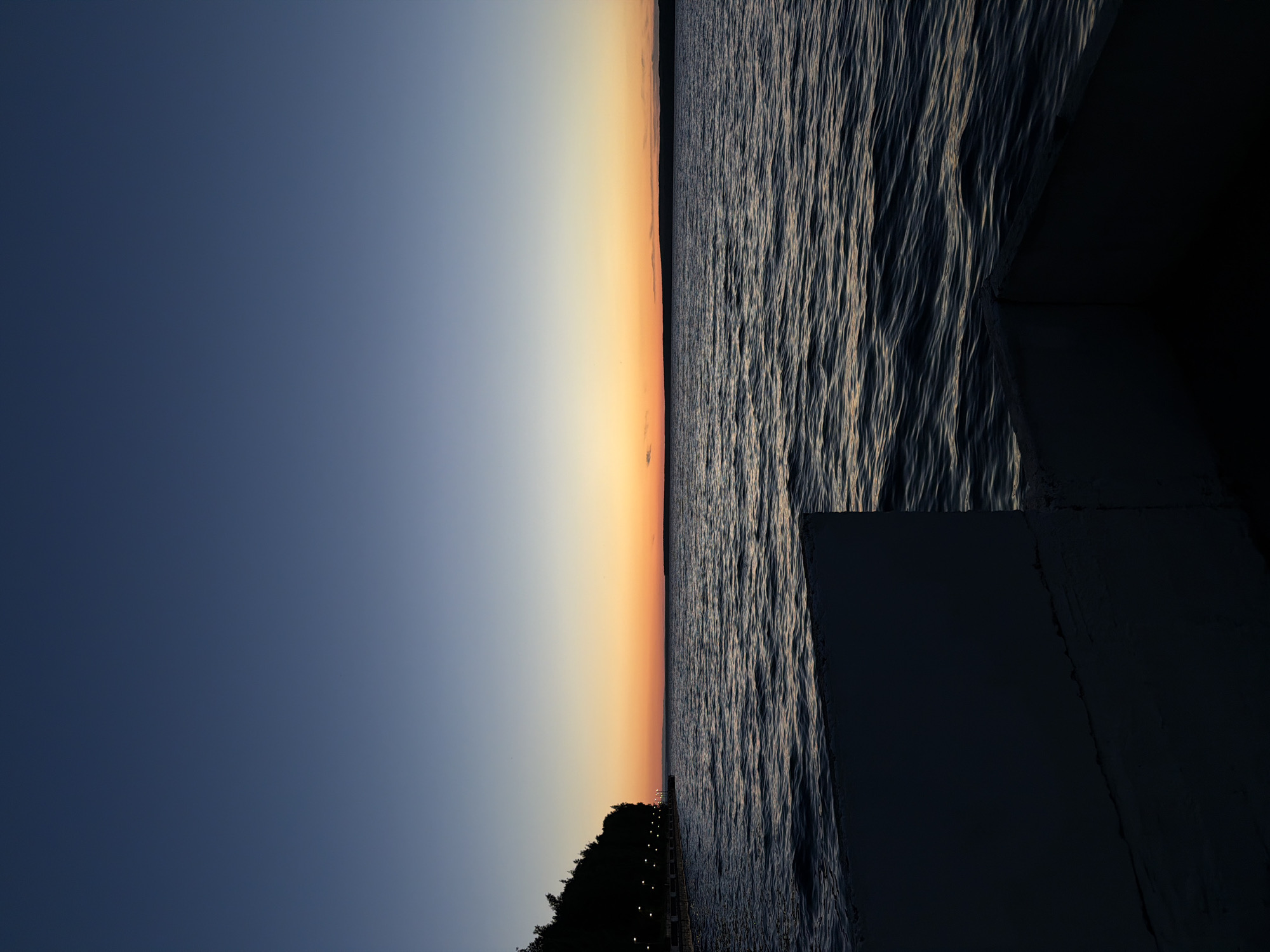 Evening waterfront sunset documented in Chaikovsky, Russia