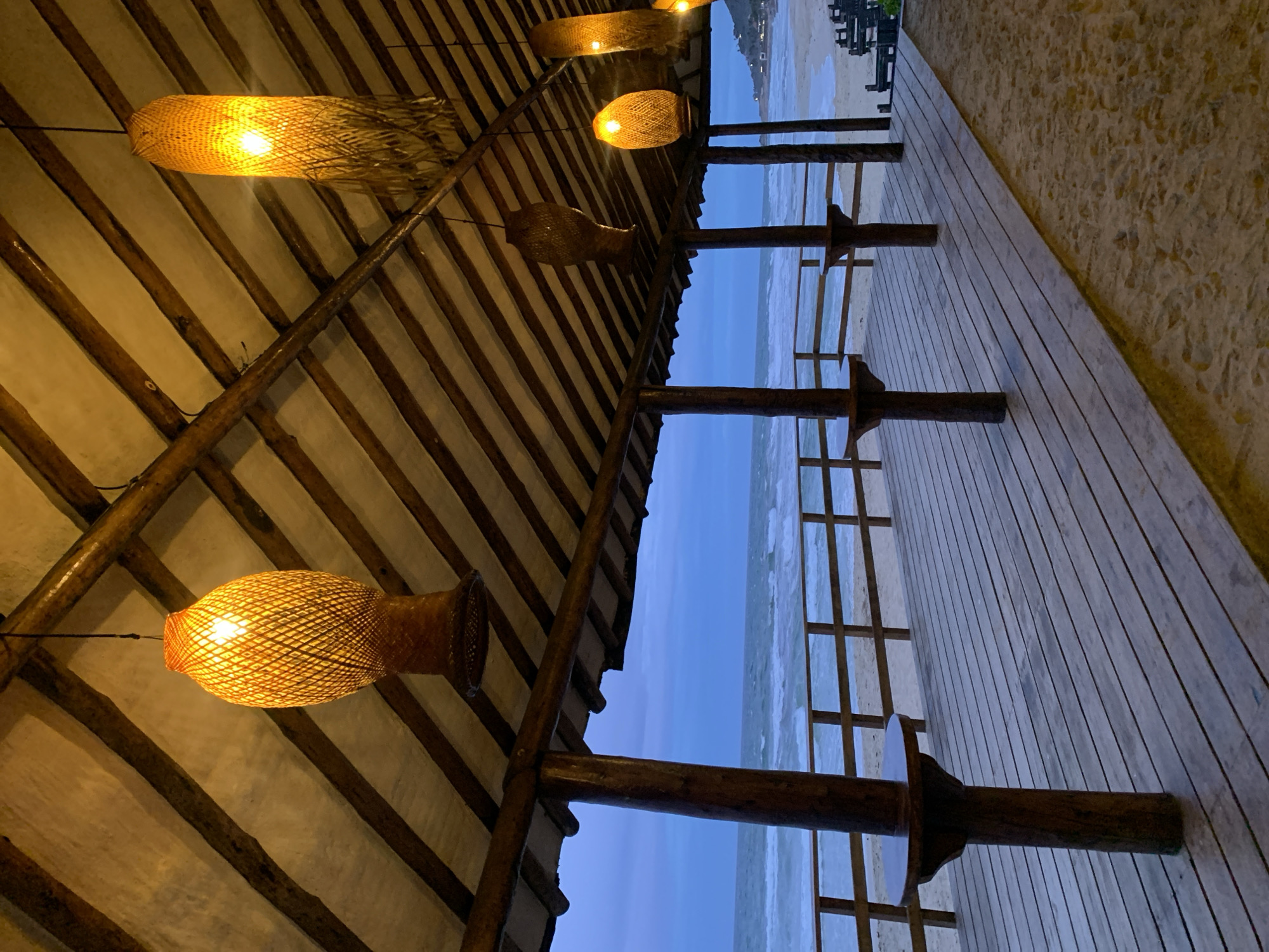 Dusk at a thatched beachside spot in El Tirano, Venezuela