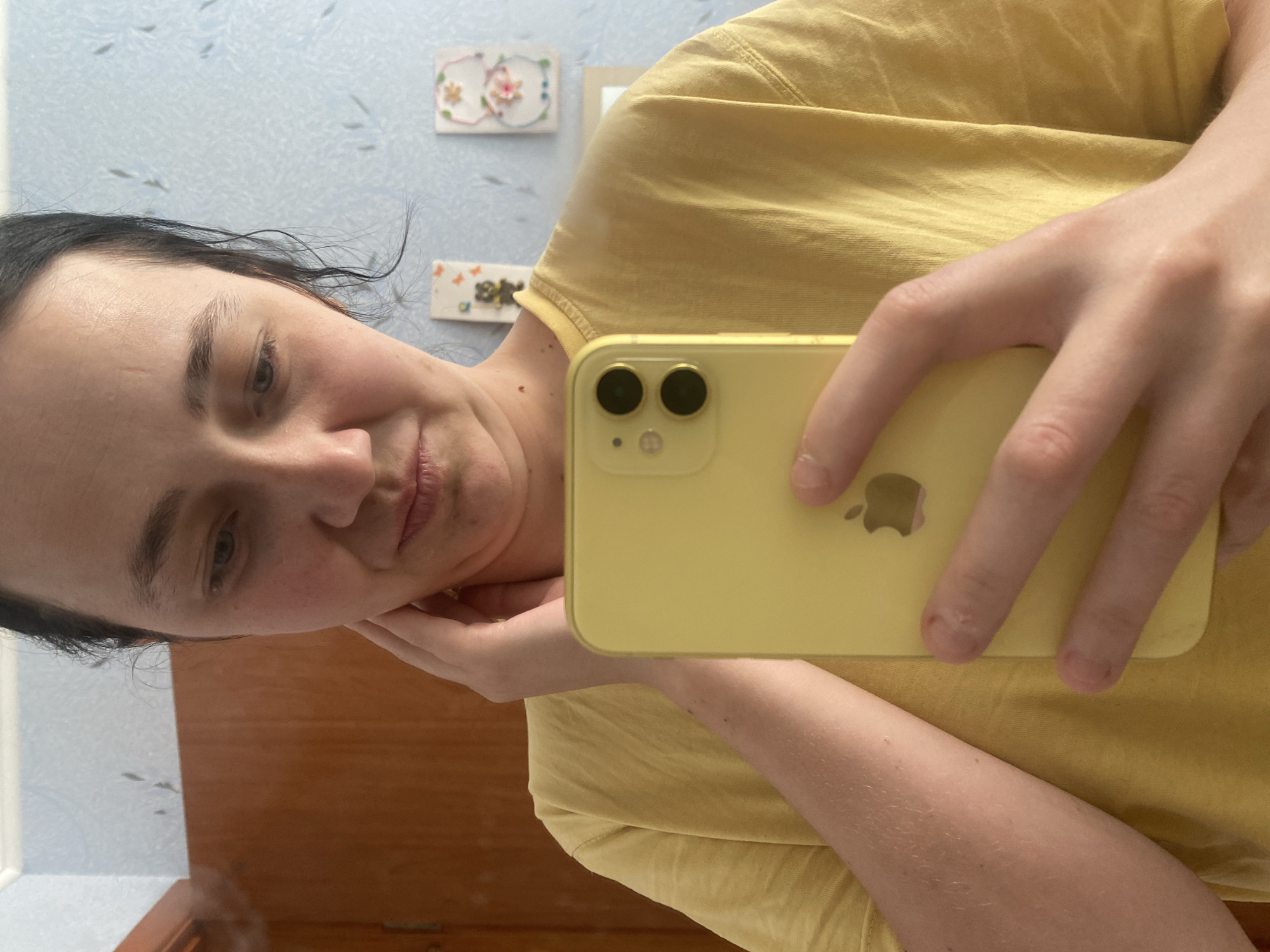 Casual bedroom selfie session with a child nearby