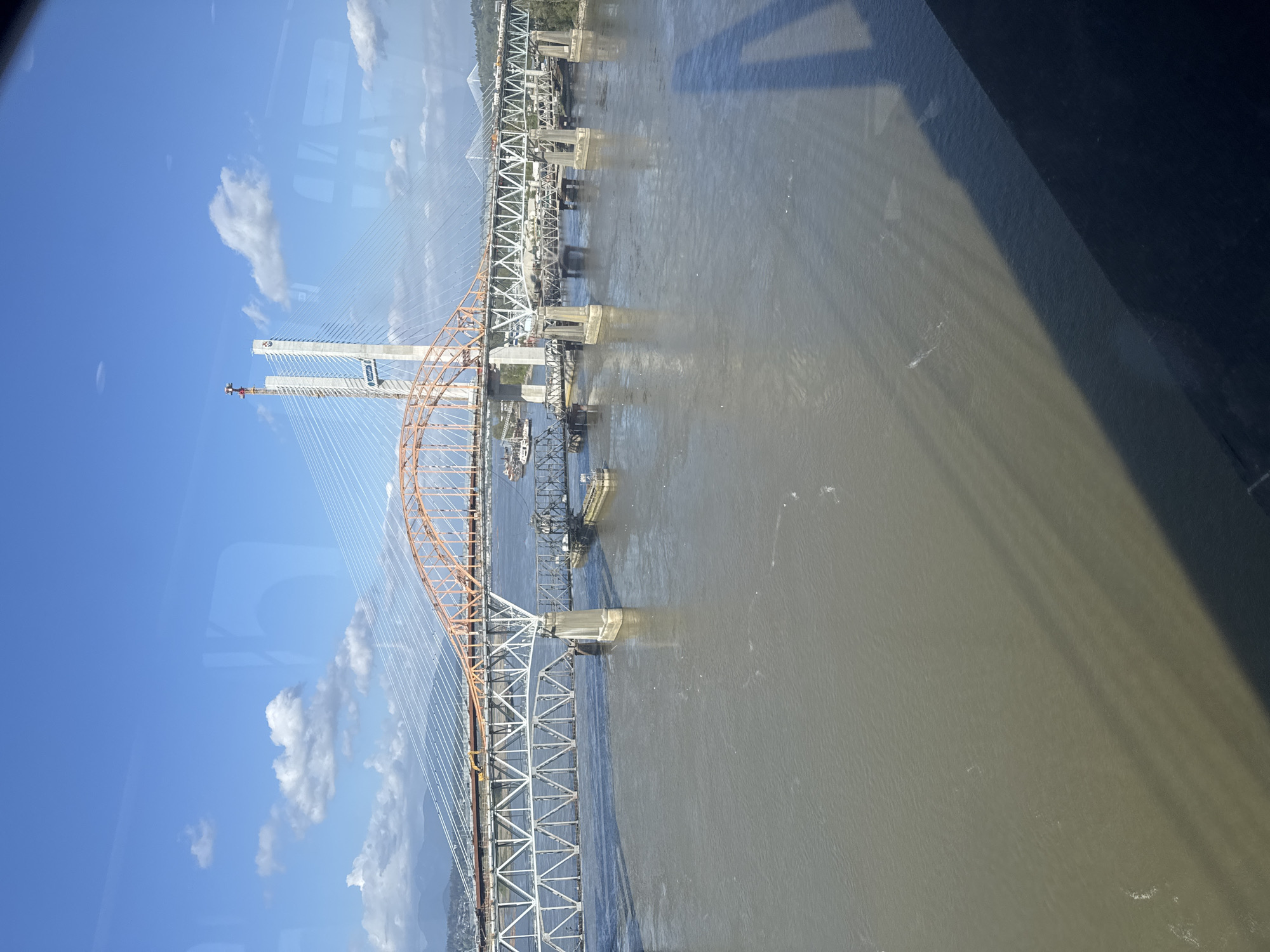 Bridge construction progress documented from aerial and ground perspectives