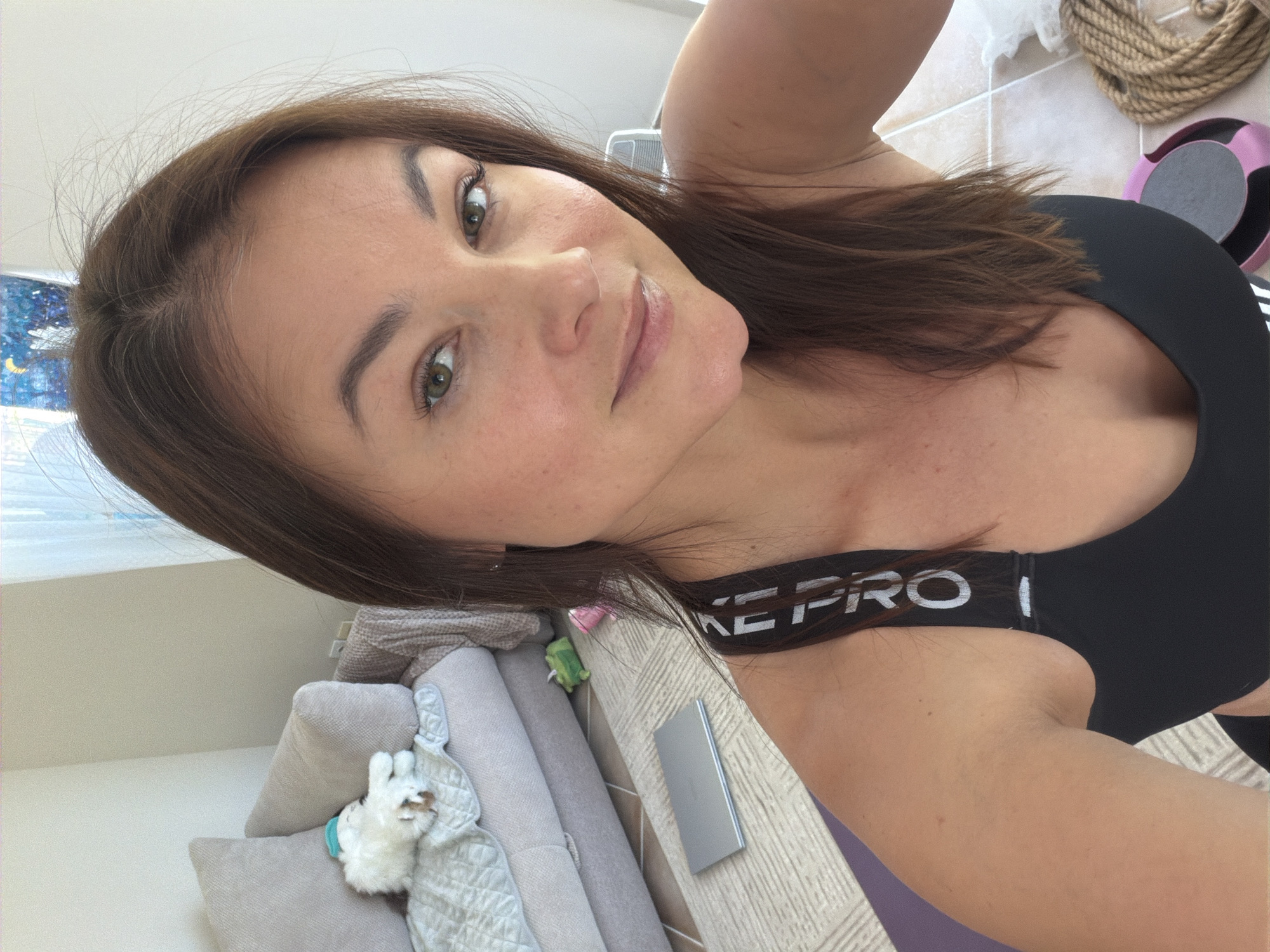 Woman takes selfie in athletic wear in Montenegro home