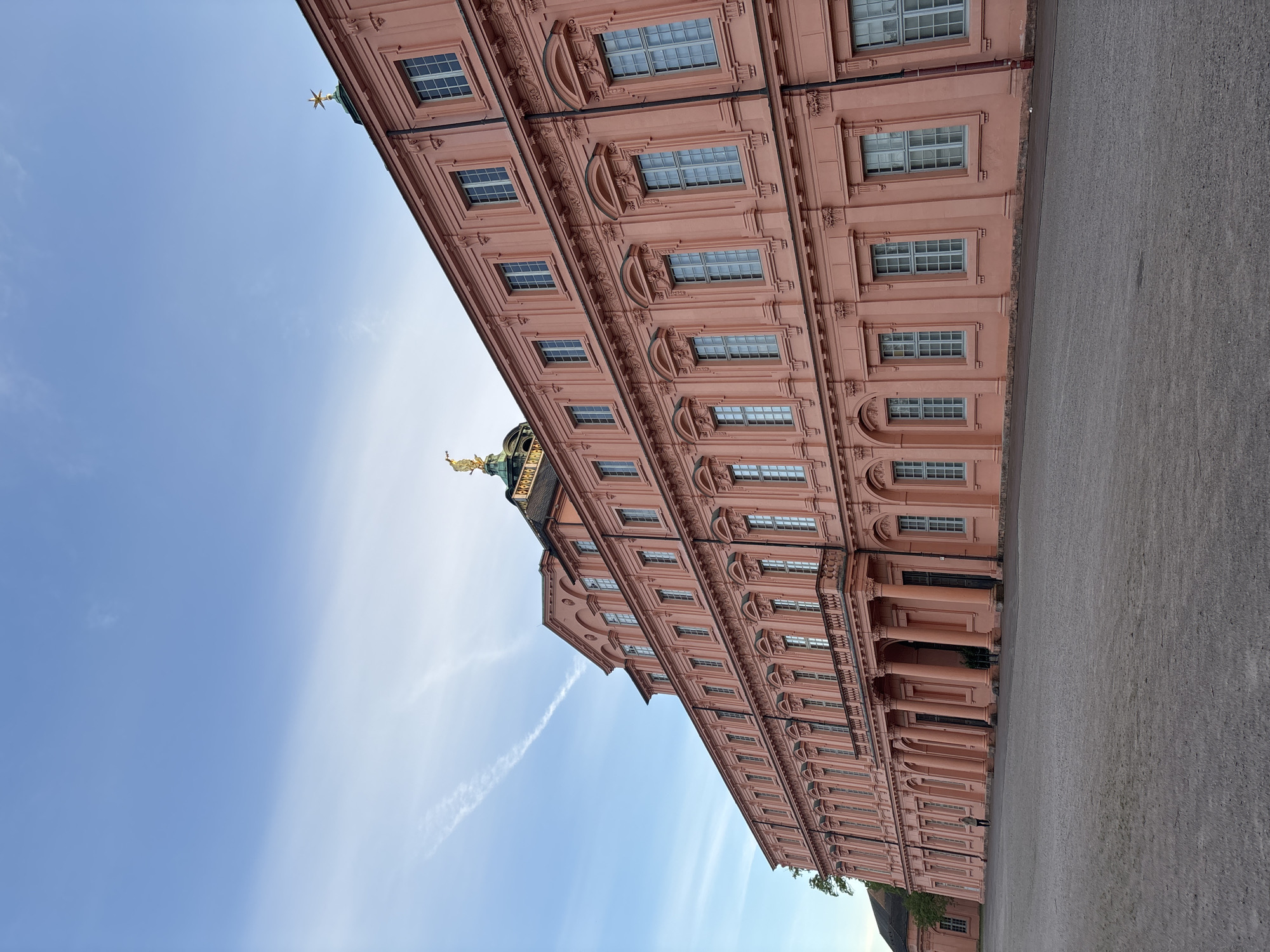 Pink ornate building with golden dome observed in Rastatt